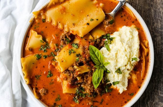 Lasagna Soup. A hearty beef lasagna soup with fresh ricotta cheese, mozzarella, and parmesan cheeses and fresh herbs. An Italian classic made into a comforting soup! #lasagnasoup #soup #soups #comfortfood