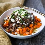 Braised Beef and Sweet Potato Hash Bowl. Tender braised beef on top of a sweet potato onion hash and topped with feta cheese and herbs. www.modernhoney.com #bowl #bowls #dinner