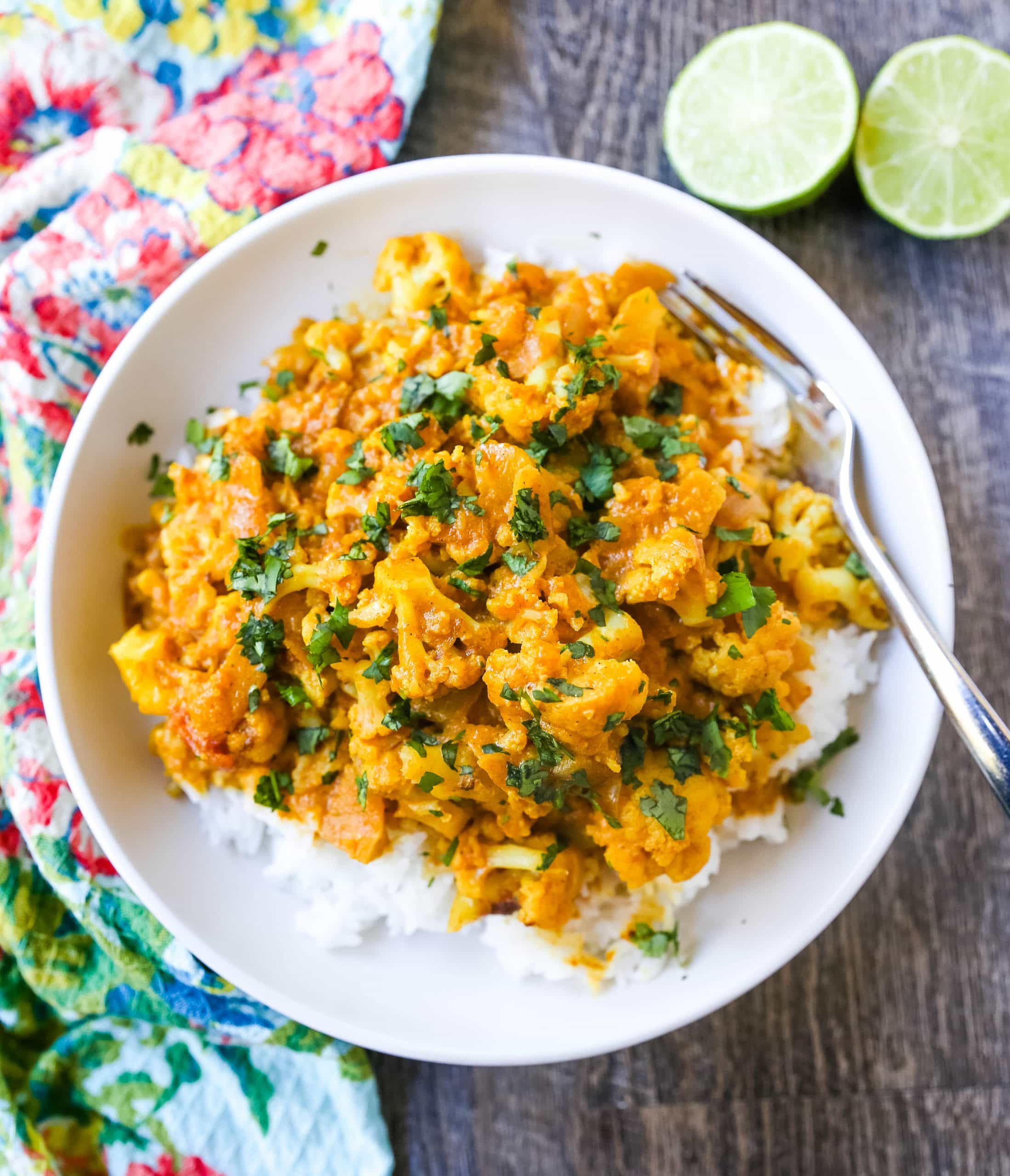 Coconut Cauliflower Curry A rich coconut curry broth with onion, garlic, cauliflower, ginger, Indian spices in coconut milk. Flavorful vegan meal and you won’t even miss the meat! www.modernhoney.com #curry #cauliflower #cauliflowercurry #indianfood