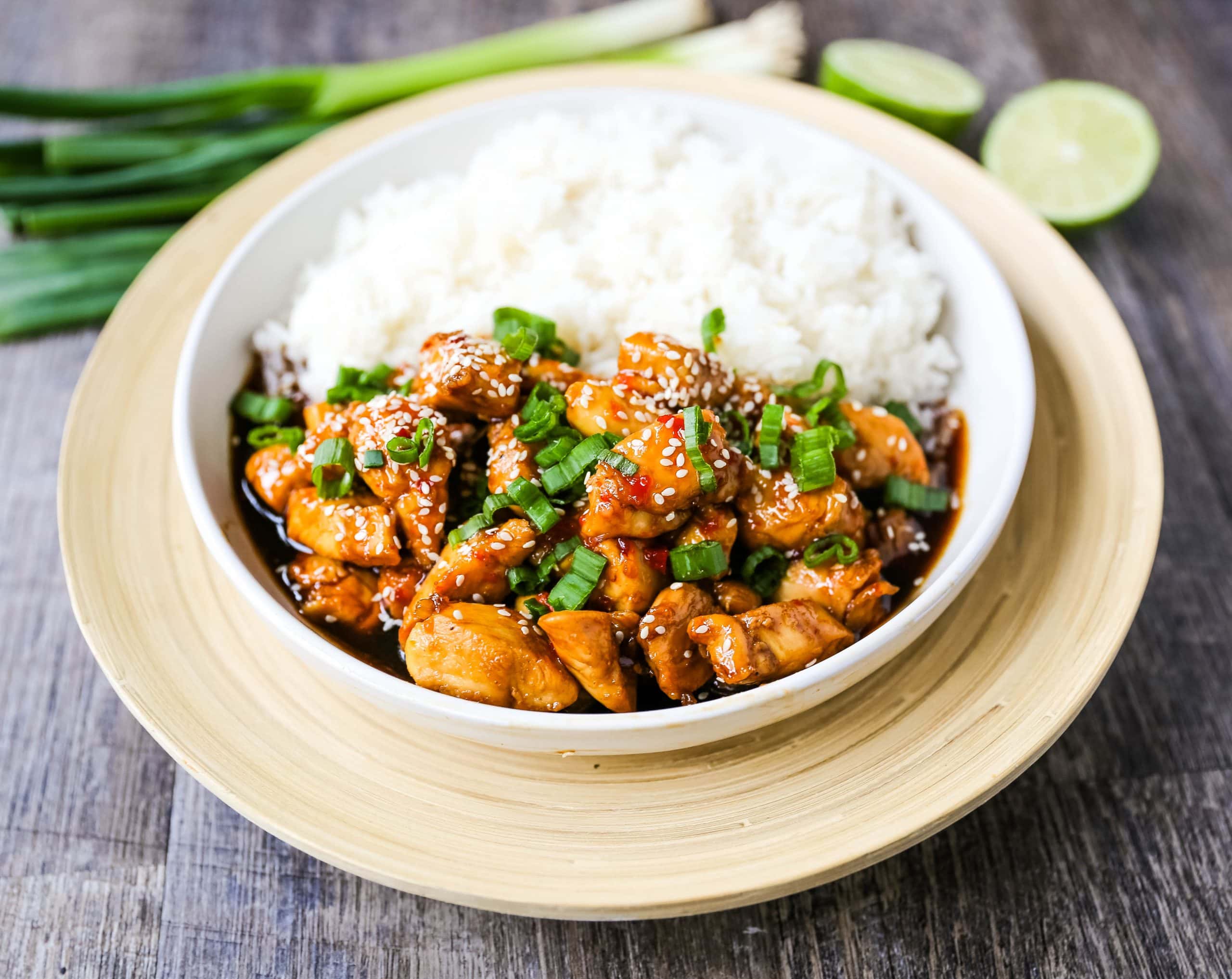 Asian Sticky Chicken Tender chicken sauteed in a sticky sweet and tangy Asian sauce served with creamy coconut rice. A quick and easy 20-minute dinner! www.modernhoney.com #asianfood #chinesefood #stickychicken #chicken 