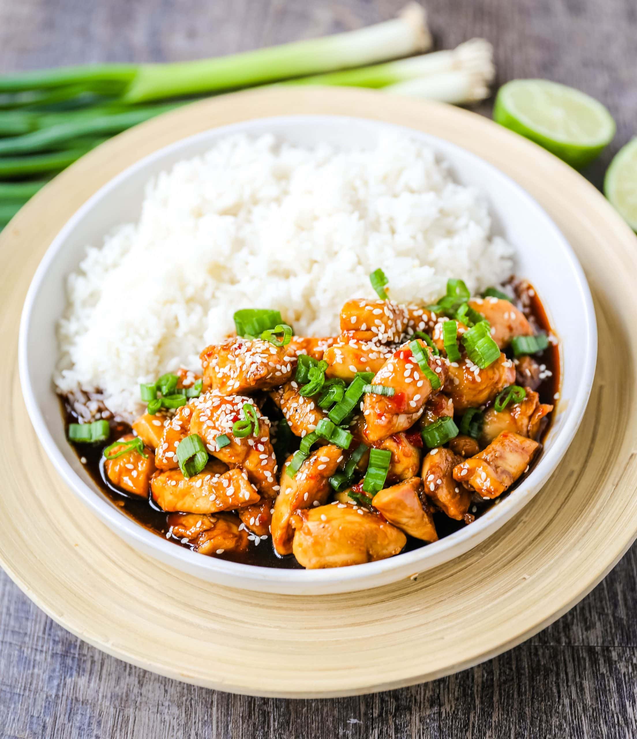 Asian Sticky Chicken Tender chicken sauteed in a sticky sweet and tangy Asian sauce served with creamy coconut rice. A quick and easy 20-minute dinner! www.modernhoney.com #asianfood #chinesefood #stickychicken #chicken 