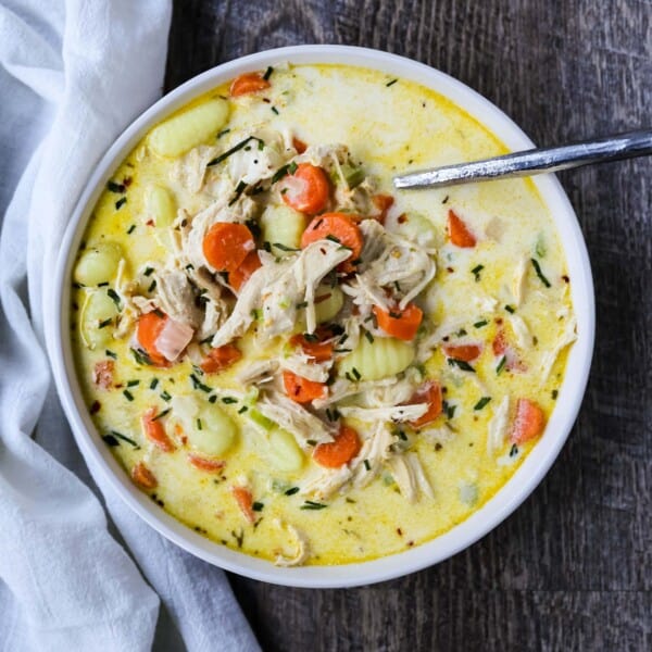 Creamy Gnocchi Chicken Soup Creamy chicken and vegetable soup with soft gnocchi pasta in a parmesan cheese creamy both. A warm, comforting bowl of comfort food! www.modernhoney.com #soup #soups #chickensoup