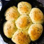 Homemade Garlic Butter Rolls. Made from scratch, fluffy homemade pull-apart rolls slathered in garlic herb butter. The perfect buttery homemade pull-apart rolls recipe! www.modernhoney.com #garlicbutterrolls #homemaderolls #rolls #dinnerrolls #pullapartrolls