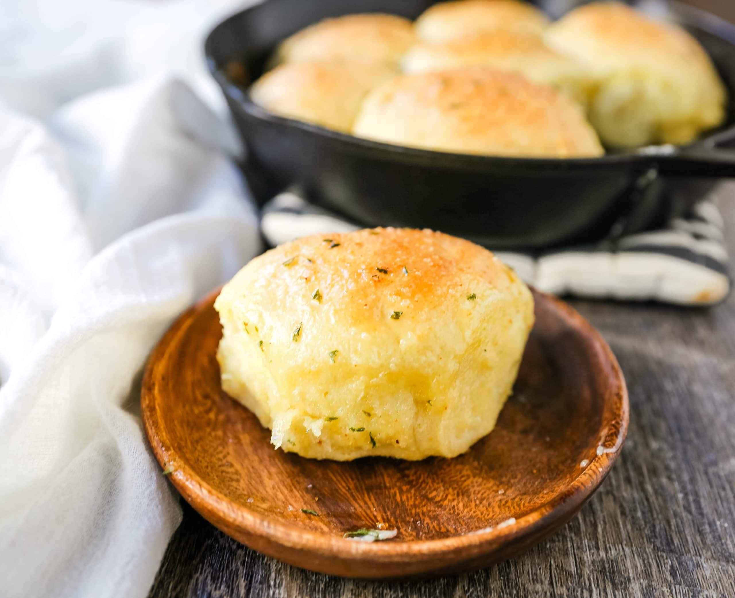 Homemade Garlic Butter Rolls. Made from scratch, fluffy homemade pull-apart rolls slathered in garlic herb butter. The perfect buttery homemade pull-apart rolls recipe! www.modernhoney.com #garlicbutterrolls #homemaderolls #rolls #dinnerrolls #pullapartrolls