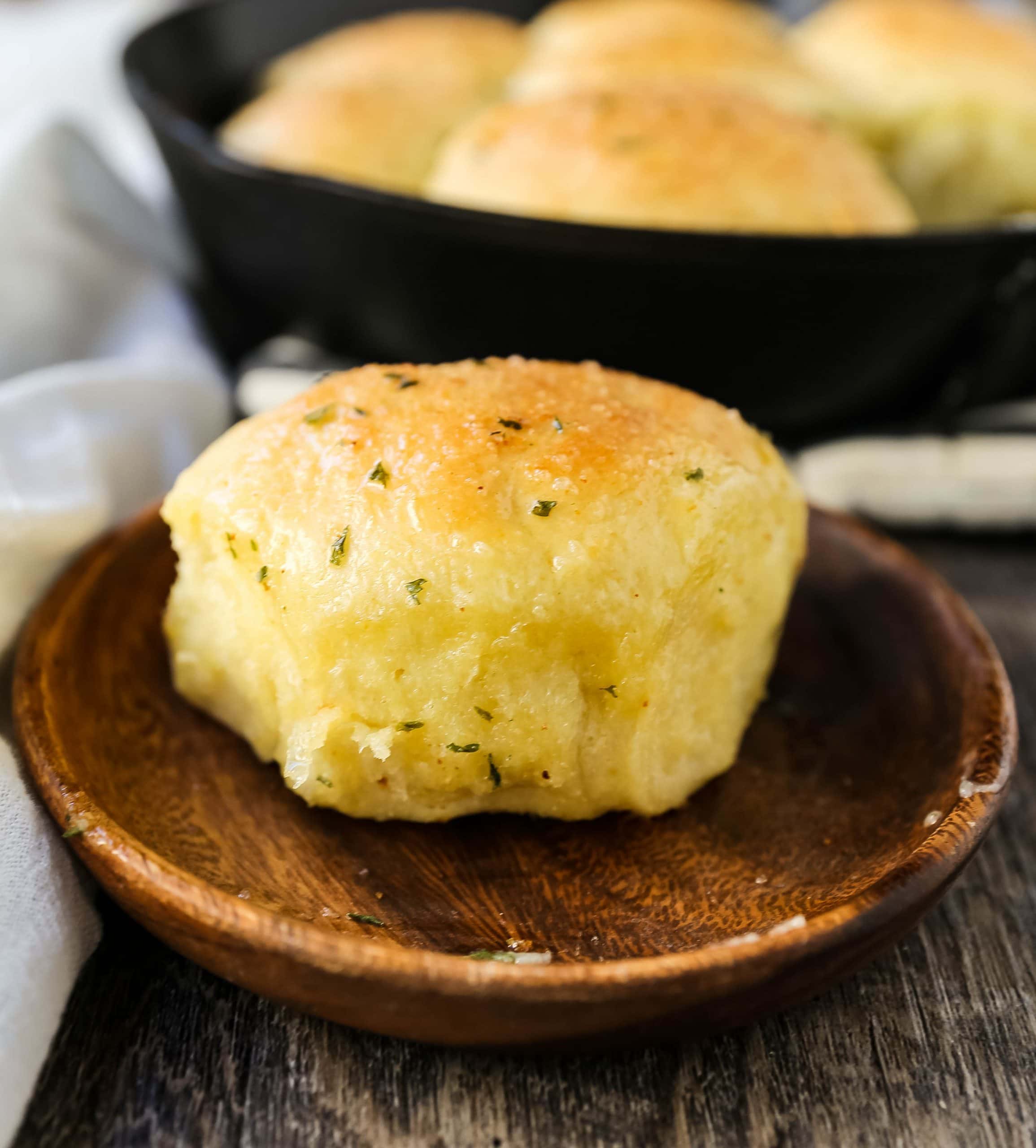 Homemade Garlic Butter Rolls. Made from scratch, fluffy homemade pull-apart rolls slathered in garlic herb butter. The perfect buttery homemade pull-apart rolls recipe! www.modernhoney.com #garlicbutterrolls #homemaderolls #rolls #dinnerrolls #pullapartrolls