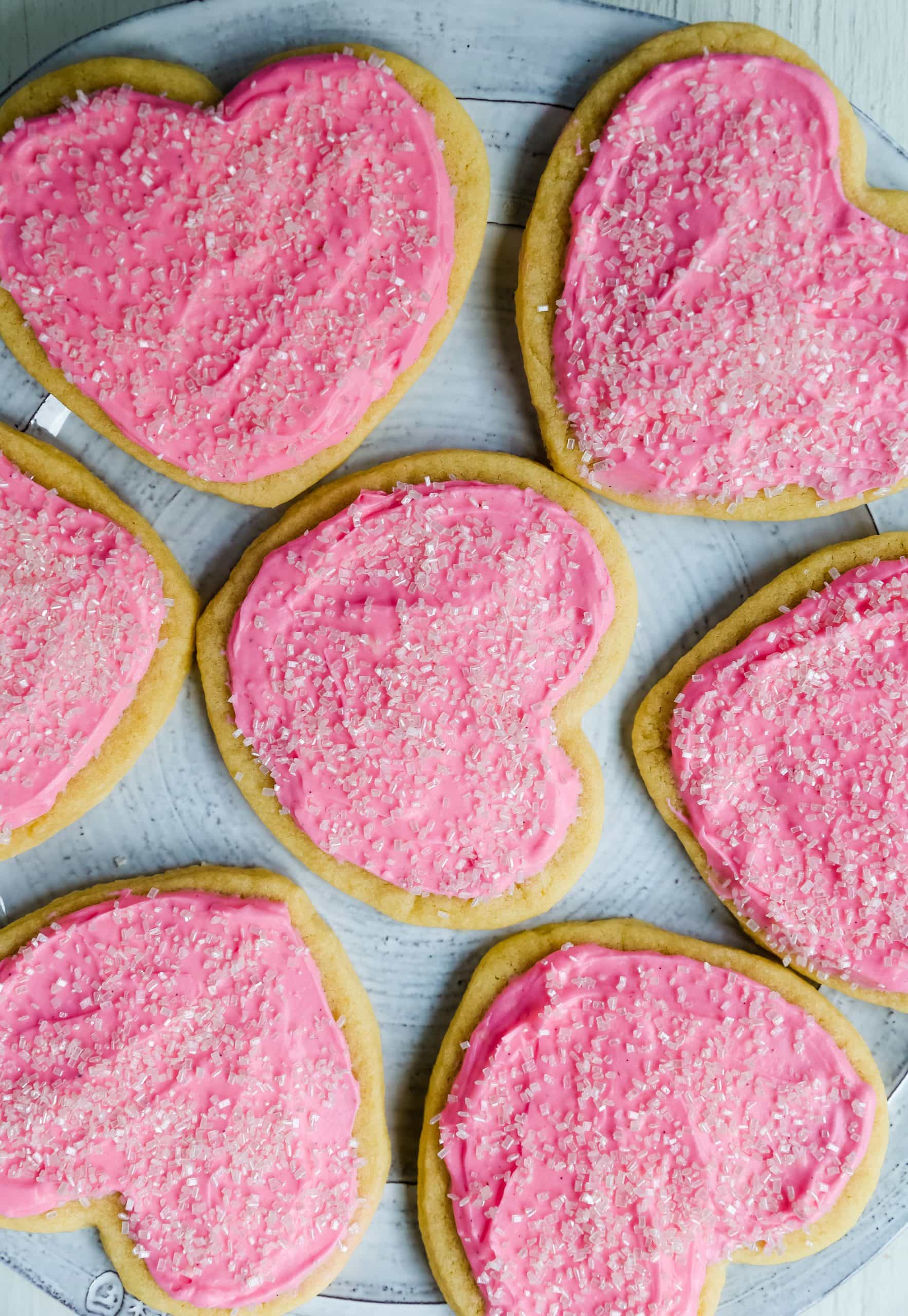 Jacque's Buttery Sugar Cookies. Homemade buttery sugar cookies with sweet buttercream frosting. The perfect frosted sugar cookie recipe! www.modernhoney.com #sugarcookies #buttercookies #buttersugarcookies #heartcookies #valentinesday #valentinesdaycookies