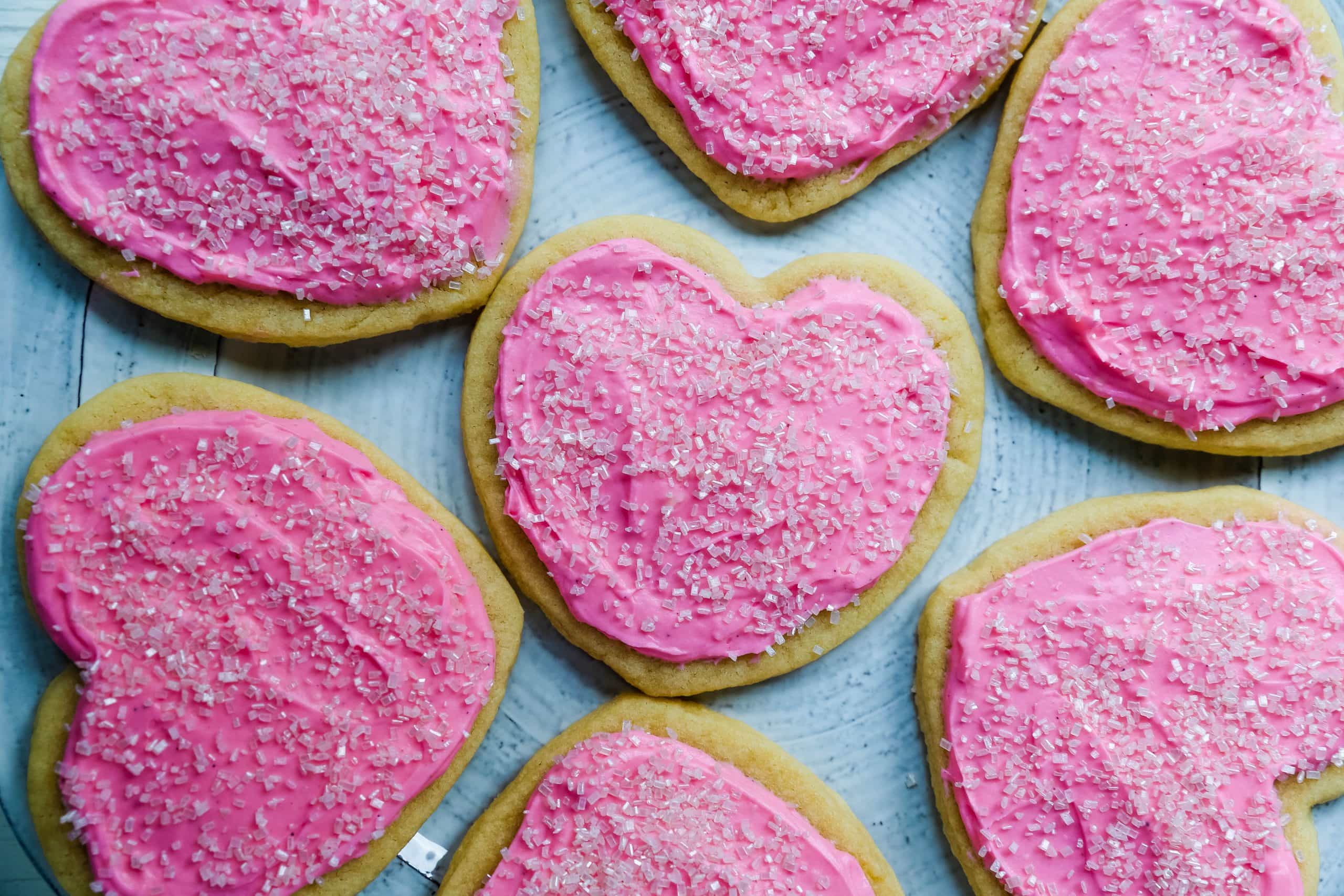 Jacque's Buttery Sugar Cookies. Homemade buttery sugar cookies with sweet buttercream frosting. The perfect frosted sugar cookie recipe! www.modernhoney.com #sugarcookies #buttercookies #buttersugarcookies #heartcookies #valentinesday #valentinesdaycookies