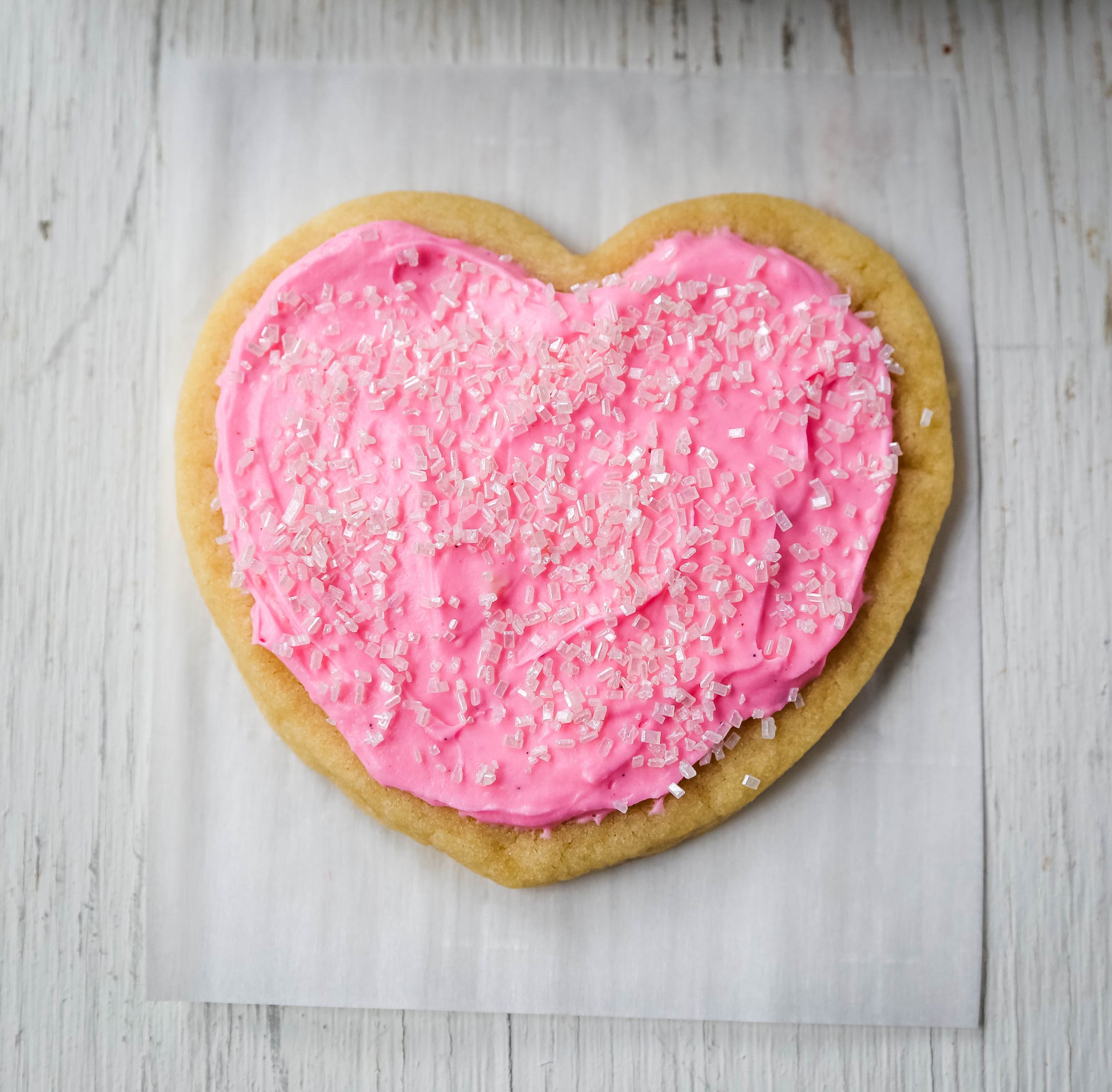 Jacque's Buttery Sugar Cookies. Homemade buttery sugar cookies with sweet buttercream frosting. The perfect frosted sugar cookie recipe! www.modernhoney.com #sugarcookies #buttercookies #buttersugarcookies #heartcookies #valentinesday #valentinesdaycookies