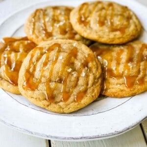 Salted Caramel Cookies Soft chewy caramel cookies with sea salt and drizzled with salted caramel. www.modernhoney.com #cookie #cookies #caramel #caramelcookie #saltedcaramel #seasaltcaramel