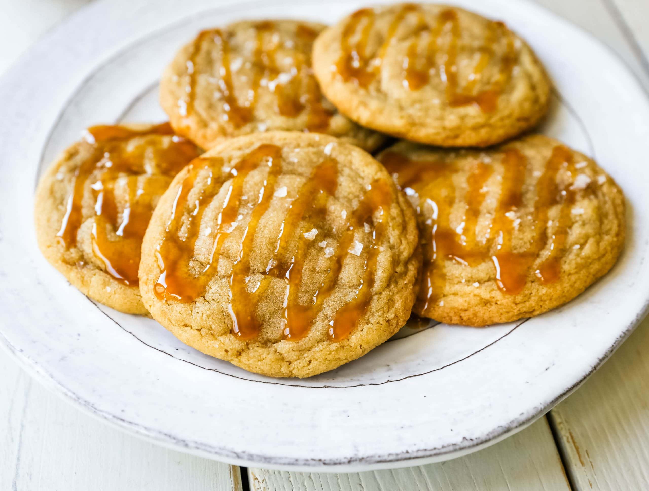 Salted Caramel Cookies Soft chewy caramel cookies with sea salt and drizzled with salted caramel. www.modernhoney.com #cookie #cookies #caramel #caramelcookie #saltedcaramel #seasaltcaramel