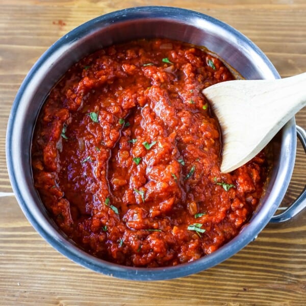 Classic Italian Tomato Sauce A robust tomato sauce made with olive oil, onion, sweet carrot, garlic, canned San Marzano tomatoes, fresh basil, tomato paste, oregano, and red pepper flakes. A flavorful, homemade tomato sauce to pair perfectly with any type of pasta. www.modernhoney.com #tomatosauce #marinara #marinarasauce #italian #italianfood