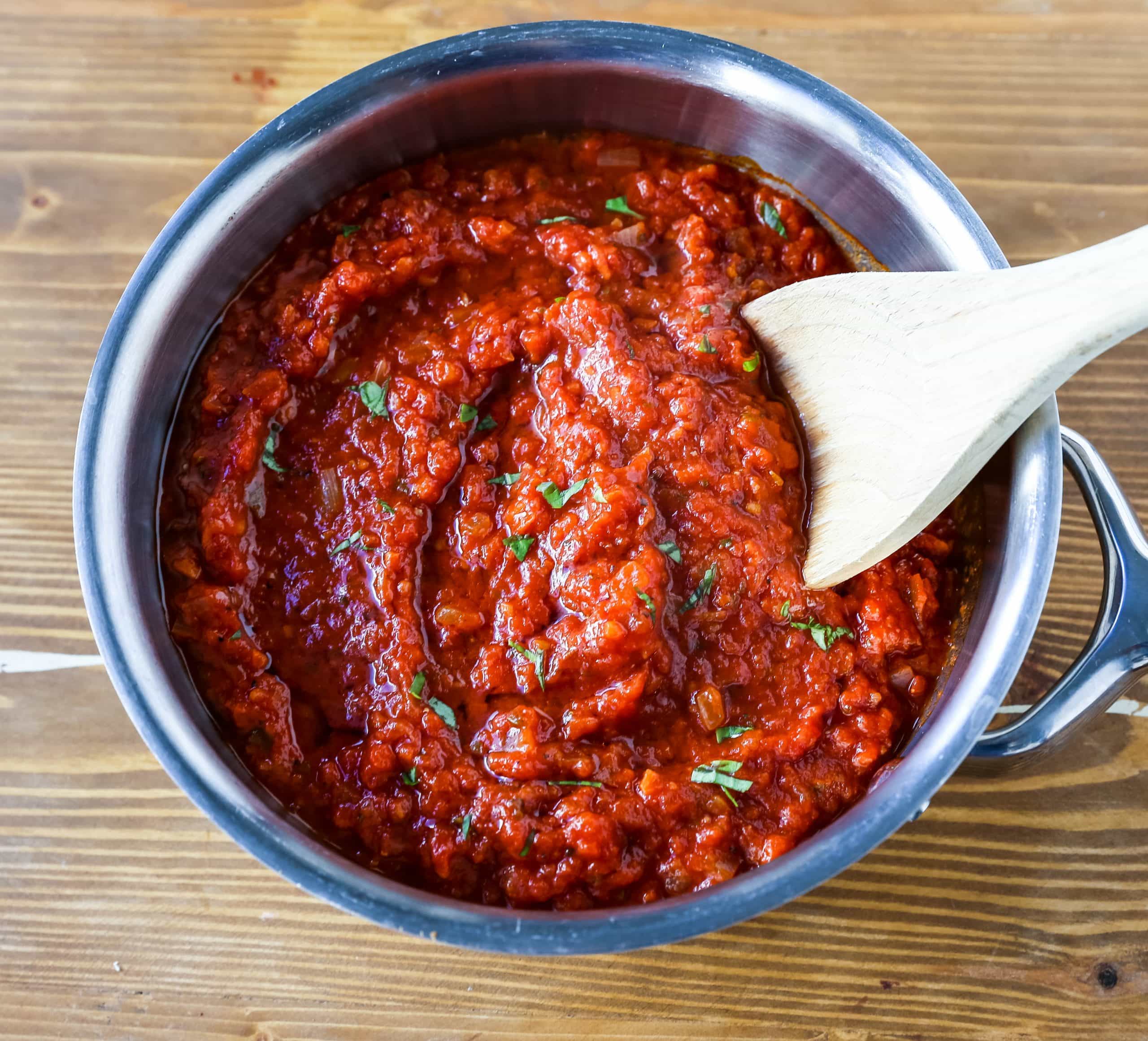 Classic Italian Tomato Sauce A robust tomato sauce made with olive oil, onion, sweet carrot, garlic, canned San Marzano tomatoes, fresh basil, tomato paste, oregano, and red pepper flakes. A flavorful, homemade tomato sauce to pair perfectly with any type of pasta. www.modernhoney.com #tomatosauce #marinara #marinarasauce #italian #italianfood