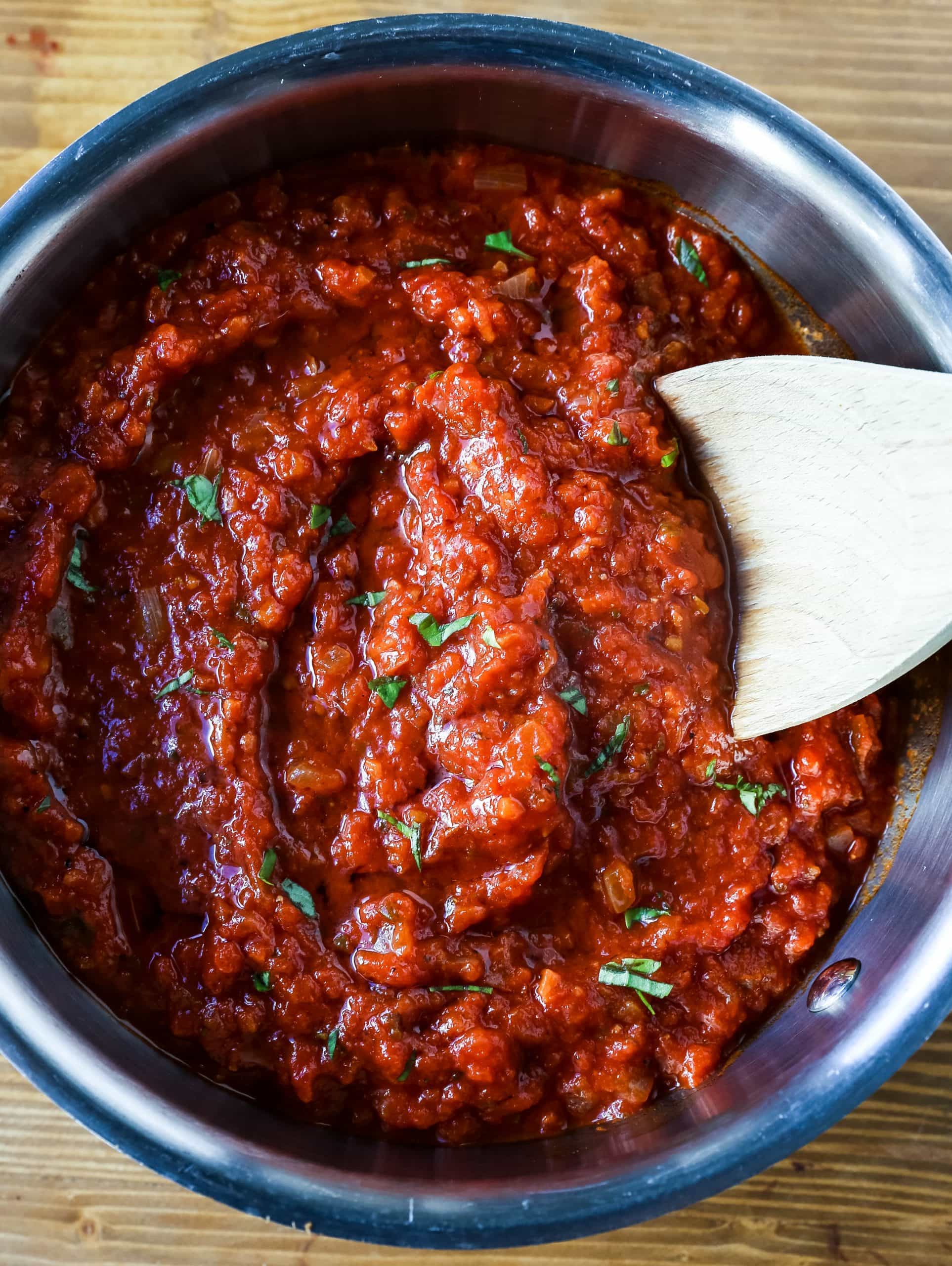 Classic Italian Tomato Sauce A robust tomato sauce made with olive oil, onion, sweet carrot, garlic, canned San Marzano tomatoes, fresh basil, tomato paste, oregano, and red pepper flakes. A flavorful, homemade tomato sauce to pair perfectly with any type of pasta. www.modernhoney.com #tomatosauce #marinara #marinarasauce #italian #italianfood