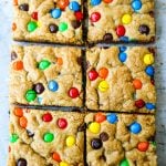 M & M Cookie Bars Soft chewy brown sugar M & M blondie cookie bars. The best M & M Cookie Bars recipe! www.modernhoney.com #bars #dessertbars #chocolatechipcookiebars