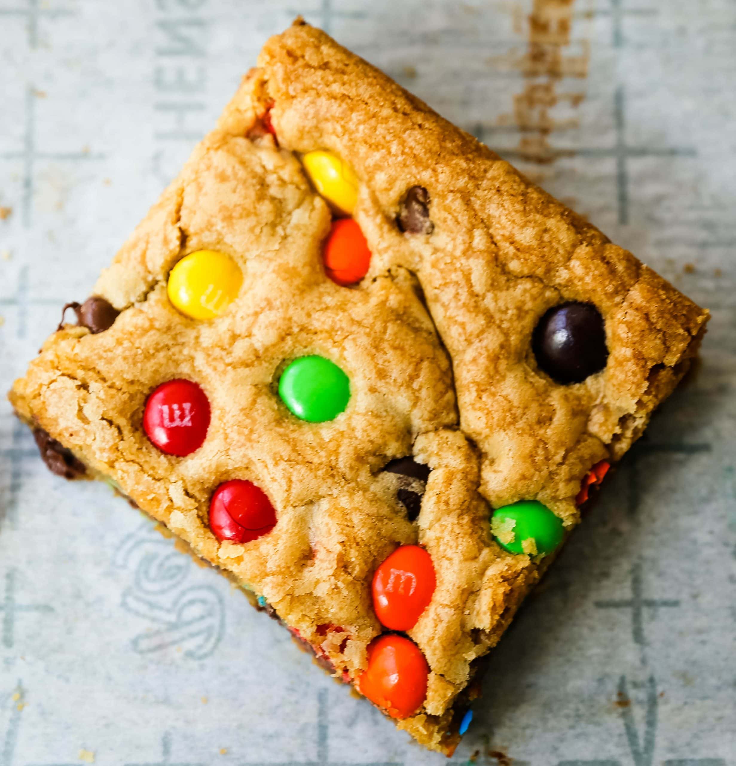 M & M Cookie Bars Soft chewy brown sugar M & M blondie cookie bars. The best M & M Cookie Bars recipe! www.modernhoney.com #bars #dessertbars #chocolatechipcookiebars