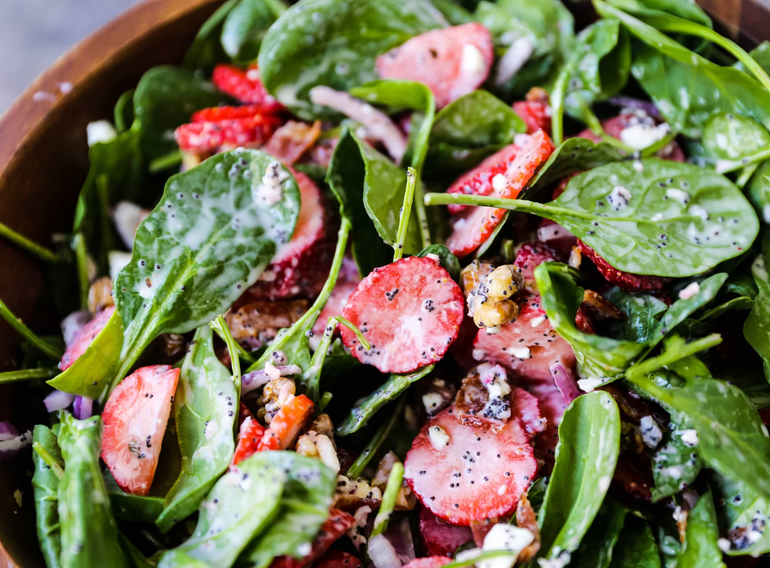 Strawberry Spinach Salad with Poppyseed Dressing Fresh spinach, sliced strawberries, feta cheese, crispy bacon, walnuts, and red onion in a sweet homemade poppyseed dressing. www.modernhoney.com #salad #salads #spinachsalad 