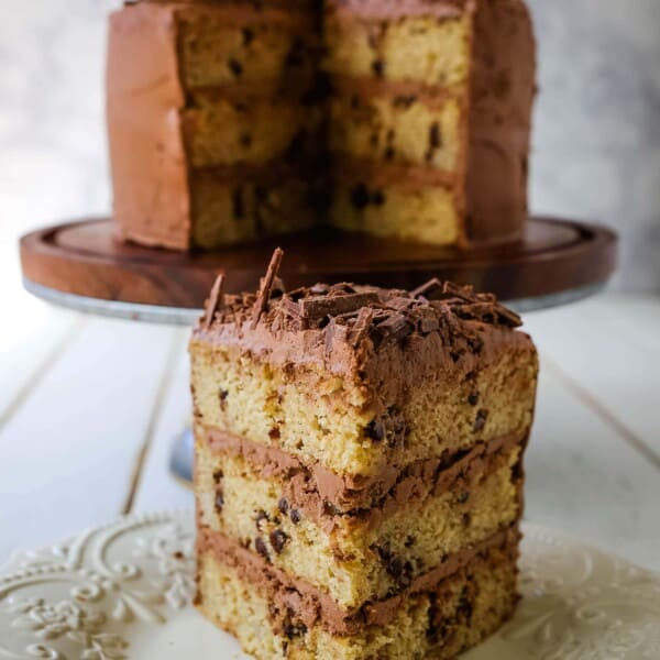 Banana Chocolate Chip Cake with Nutella Frosting. Moist banana cake studded with mini chocolate chips and topped with rich Nutella chocolate frosting. #banana #bananacake #bananachocolate #nutella