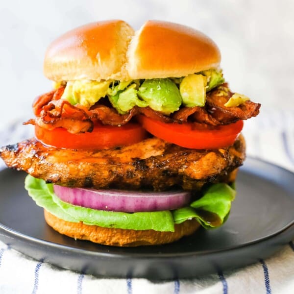 Avocado Bacon Grilled Chicken Sandwich Juicy marinated grilled chicken breast with crispy bacon, creamy avocado, juicy tomato, crisp lettuce, all on a brioche bun. www.modernhoney.com #grilledchickensandwich #chickensandwich