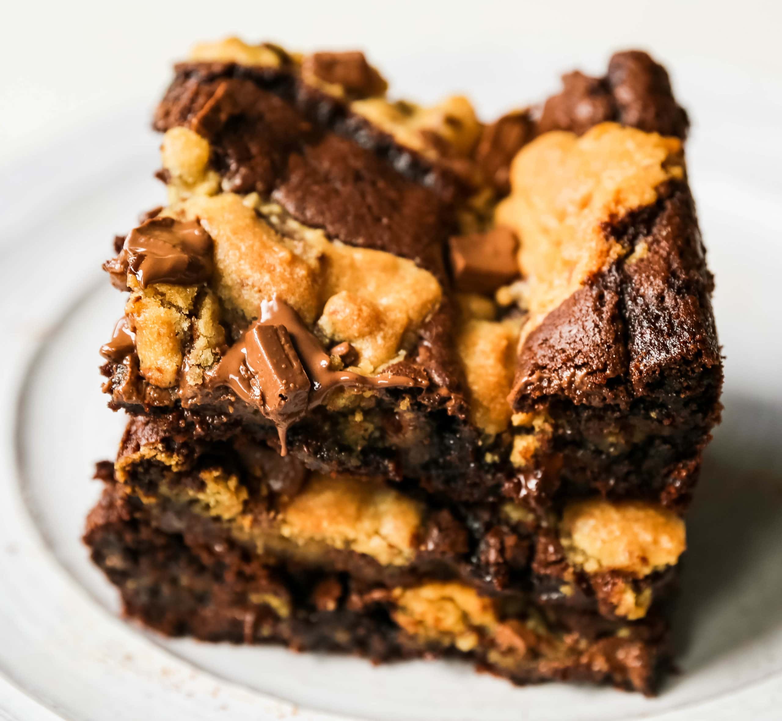 Brookies (Chocolate Chip Cookie and Brownie Bars) A homemade decadent chocolate brownie and chocolate chip cookie all in one! A brownie and chocolate chip cookie just got married. The best dessert bar! www.modernhoney.com #brookie #brookies #brownies #dessertbar