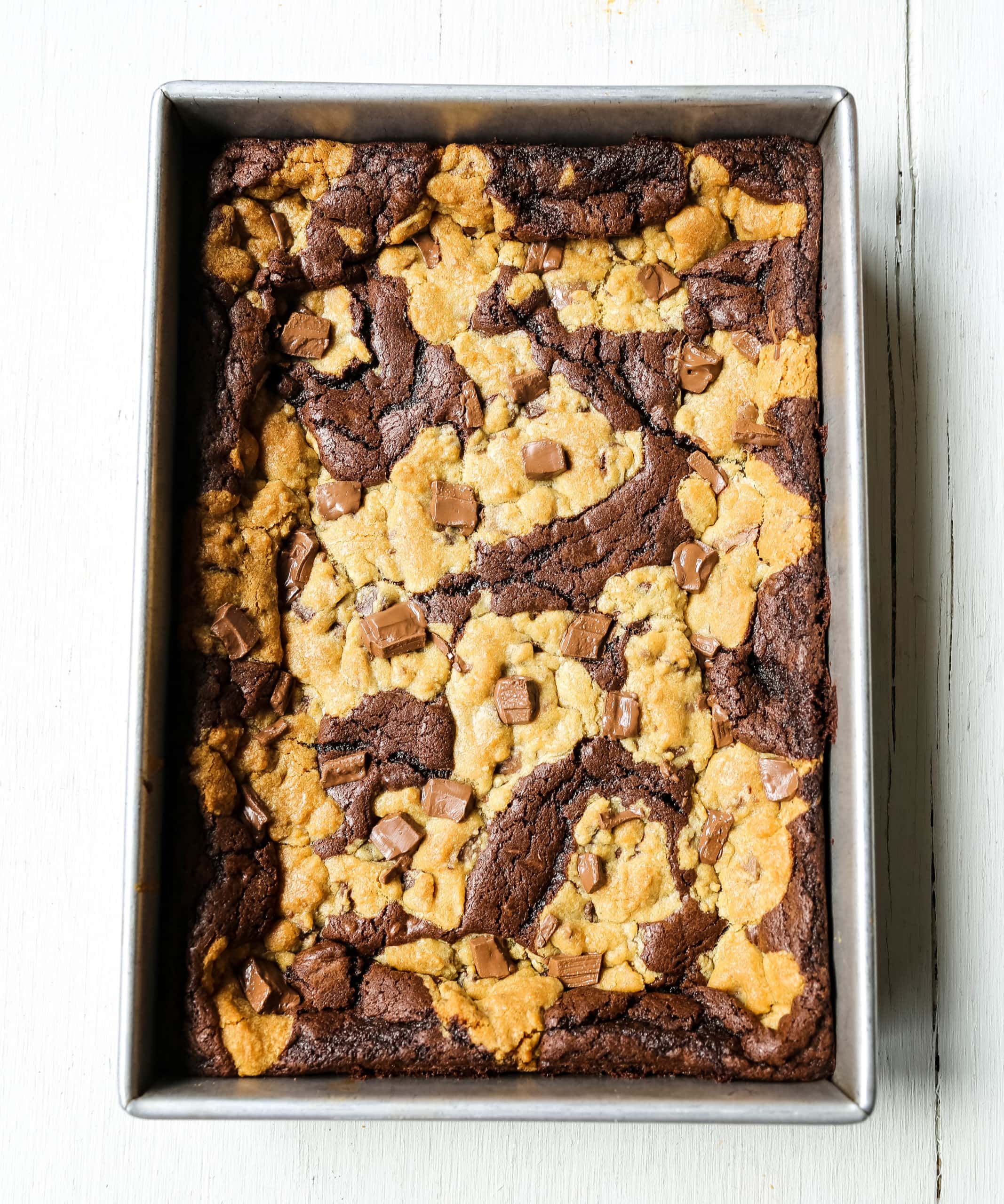 Brookies (Chocolate Chip Cookie and Brownie Bars) A homemade decadent chocolate brownie and chocolate chip cookie all in one! A brownie and chocolate chip cookie just got married. The best dessert bar! www.modernhoney.com #brookie #brookies #brownies #dessertbar