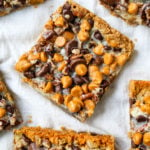 7-Layer Magic Bars. The famous dessert bars made with a graham cracker crust, sweetened flaked coconut, chocolate chips, butterscotch chips, nuts, all drizzled with sweetened condensed milk. The perfect dessert bar recipe! www.modernhoney.com #7layerbars #magicbars #magiccookiebars #sevenlayerbars