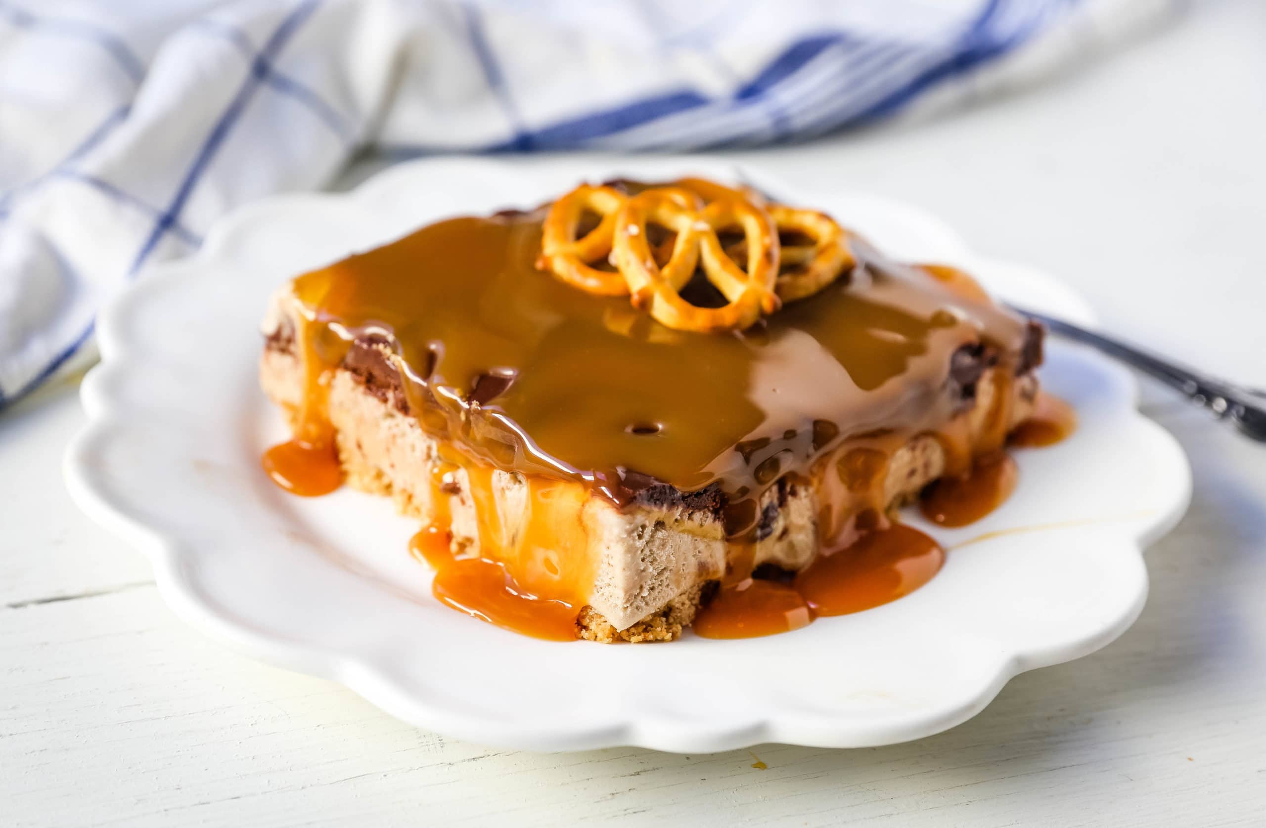 Chocolate Fudge Caramel Ice Cream Dessert Layered ice cream dessert with a sugar cone crust, salted caramel ice cream, hot fudge topping, and freshly whipped cream. The perfect ice cream dessert! #icecream #icecreampie #icecreamdessert