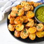 Oven Roasted Potatoes Garlic Roasted Roasted Potatoes with buttery Yukon gold potatoes baked with olive oil, garlic butter, and sprinkled with fresh parsley. The Best Roasted Potatoes recipe! www.modernhoney.com #potatoes #roastedpotatoes #sidedish