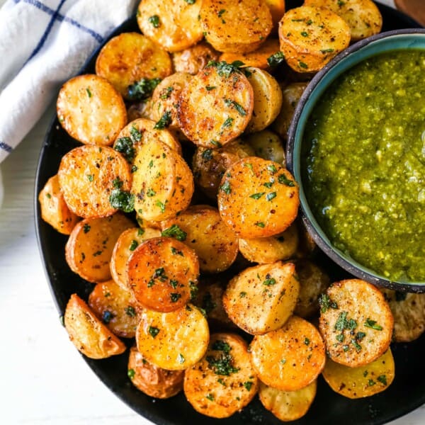 Oven Roasted Potatoes Garlic Roasted Roasted Potatoes with buttery Yukon gold potatoes baked with olive oil, garlic butter, and sprinkled with fresh parsley. The Best Roasted Potatoes recipe! www.modernhoney.com #potatoes #roastedpotatoes #sidedish