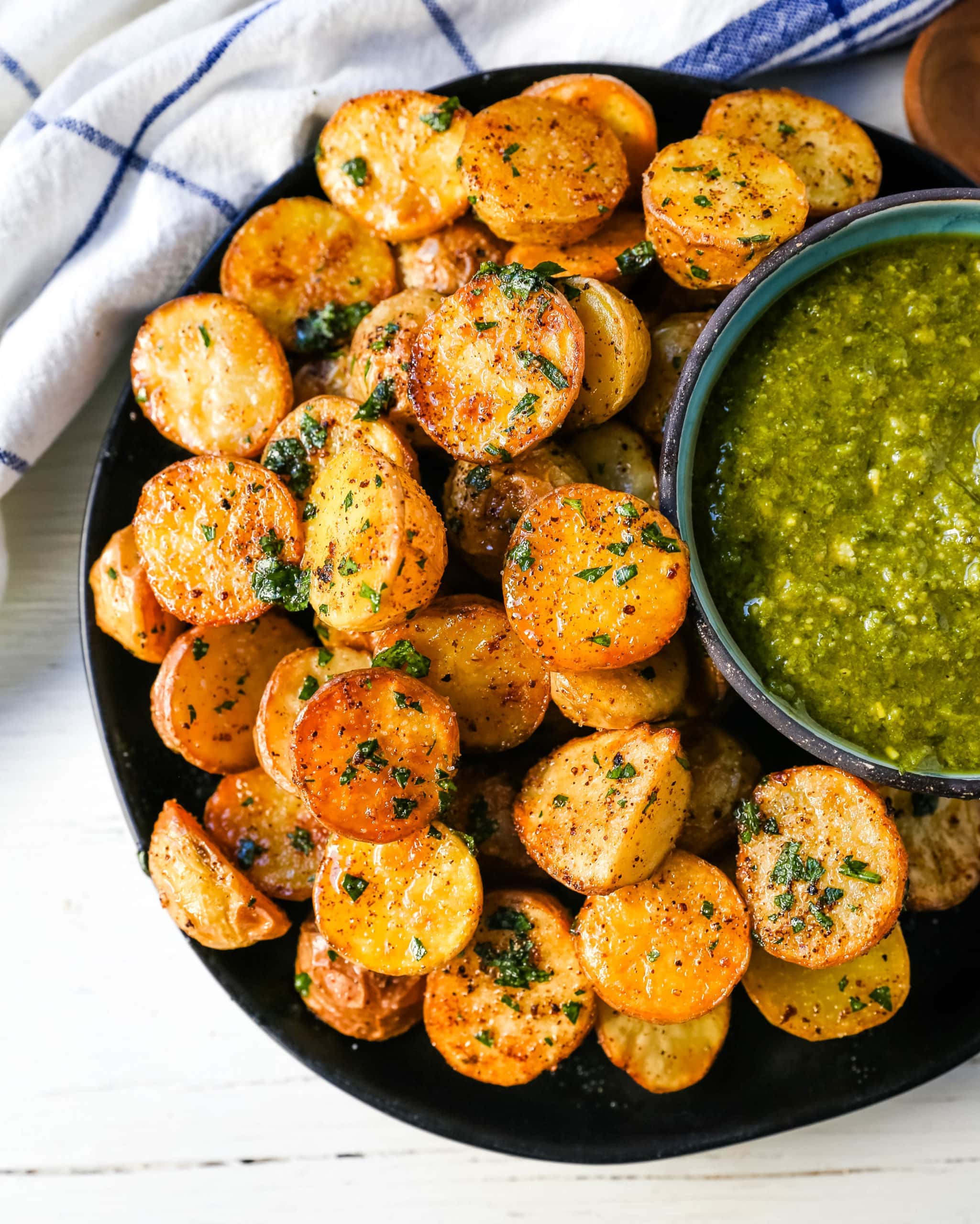 Oven Roasted Potatoes Garlic Roasted Roasted Potatoes with buttery Yukon gold potatoes baked with olive oil, garlic butter, and sprinkled with fresh parsley. The Best Roasted Potatoes recipe! www.modernhoney.com #potatoes #roastedpotatoes #sidedish