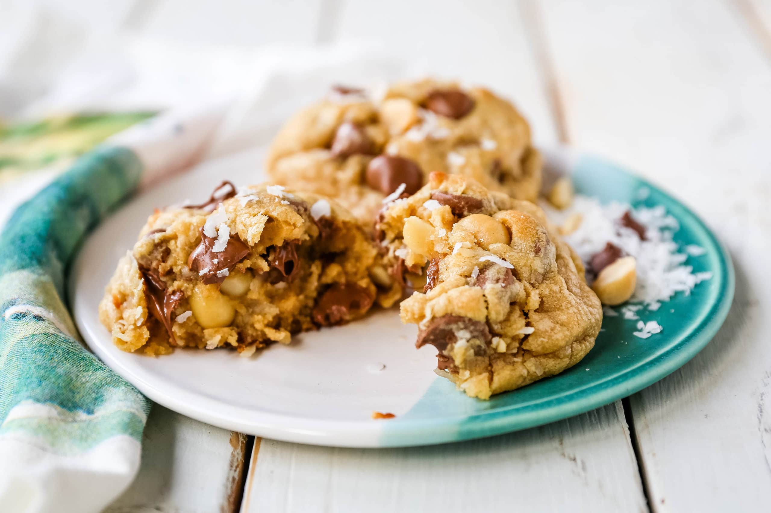 Milk Chocolate Chip Macadamia Nut Coconut Cookies Thick soft and chewy bakery-style milk chocolate chip macadamia nut coconut cookies are an Island favorite!  www.modernhoney.com #cookies #chocolatechipmacadamianut 