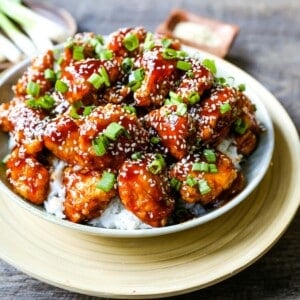 Sesame Chicken. Homemade Chinese Sesame Chicken made with crispy fried chicken covered in a sweet and sour sauce. The ultimate sesame chicken recipe is way better than take-out. www.modernhoney.com #sesamechicken #chinesefood