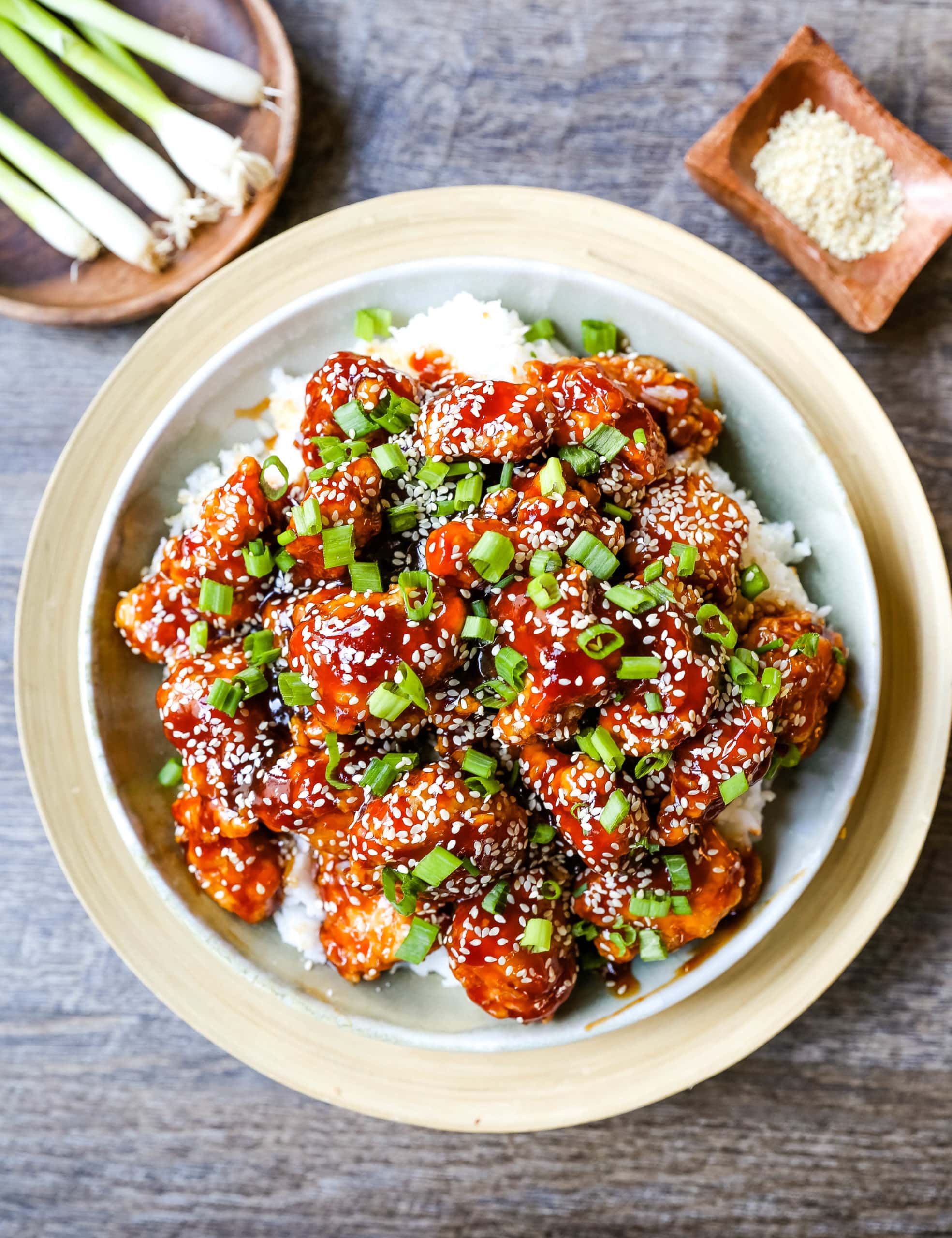 Sesame Chicken. Homemade Chinese Sesame Chicken made with crispy fried chicken covered in a sweet and sour sauce. The ultimate sesame chicken recipe is way better than take-out. www.modernhoney.com #sesamechicken #chinesefood 