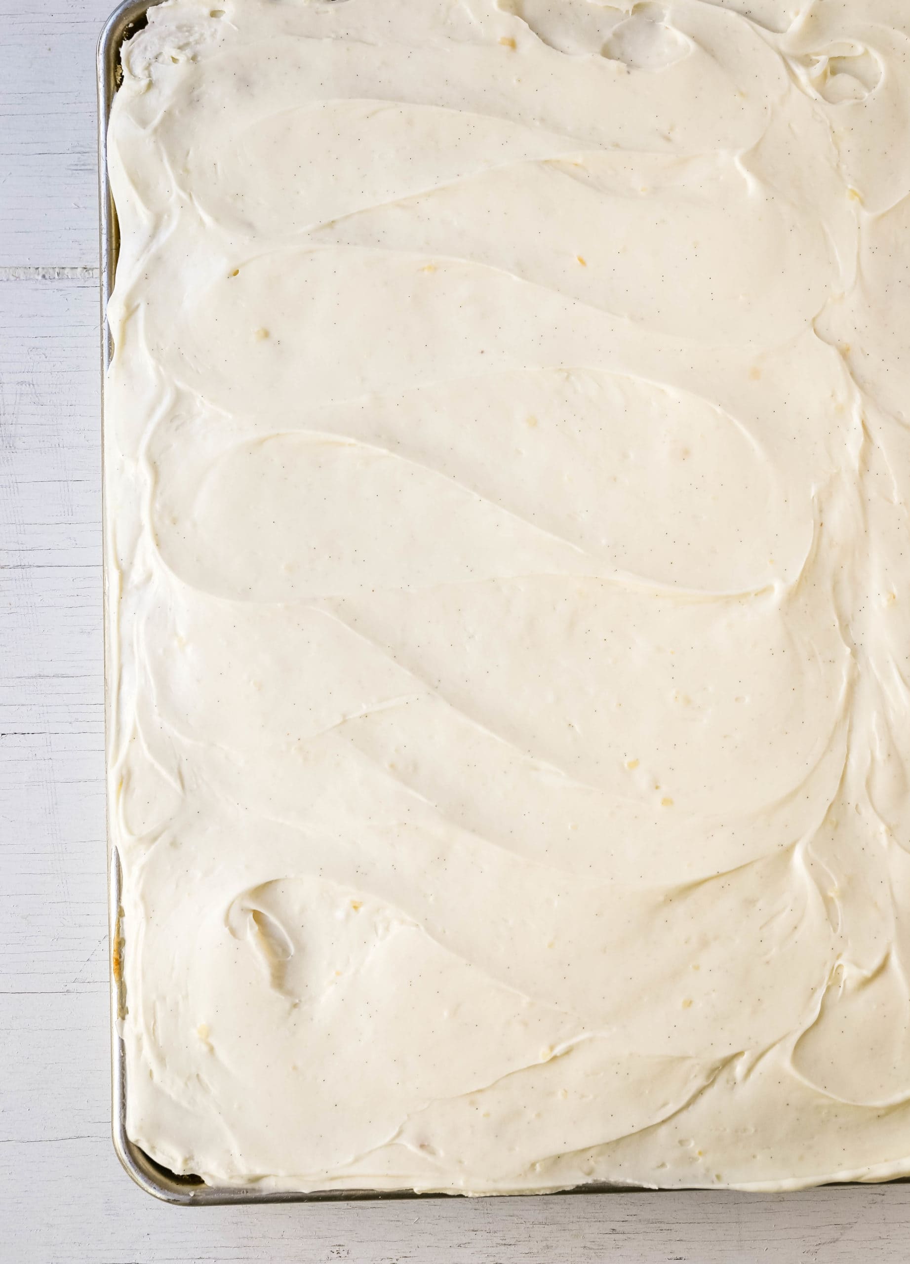 Banana Sheet Cake with Brown Butter Frosting Moist banana bars with a brown butter cream cheese buttercream. An easy frosted banana cake recipe! www.modernhoney.com #bananacake #bananabars #frostedbananacake #frostedbananabars #bananarecipes