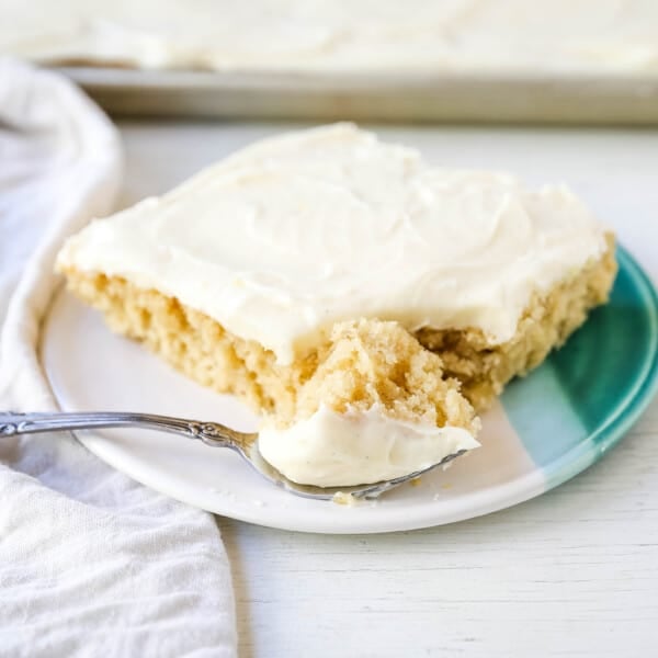 Banana Sheet Cake with Brown Butter Frosting Moist banana bars with a brown butter cream cheese buttercream. An easy frosted banana cake recipe! www.modernhoney.com #bananacake #bananabars #frostedbananacake #frostedbananabars #bananarecipes