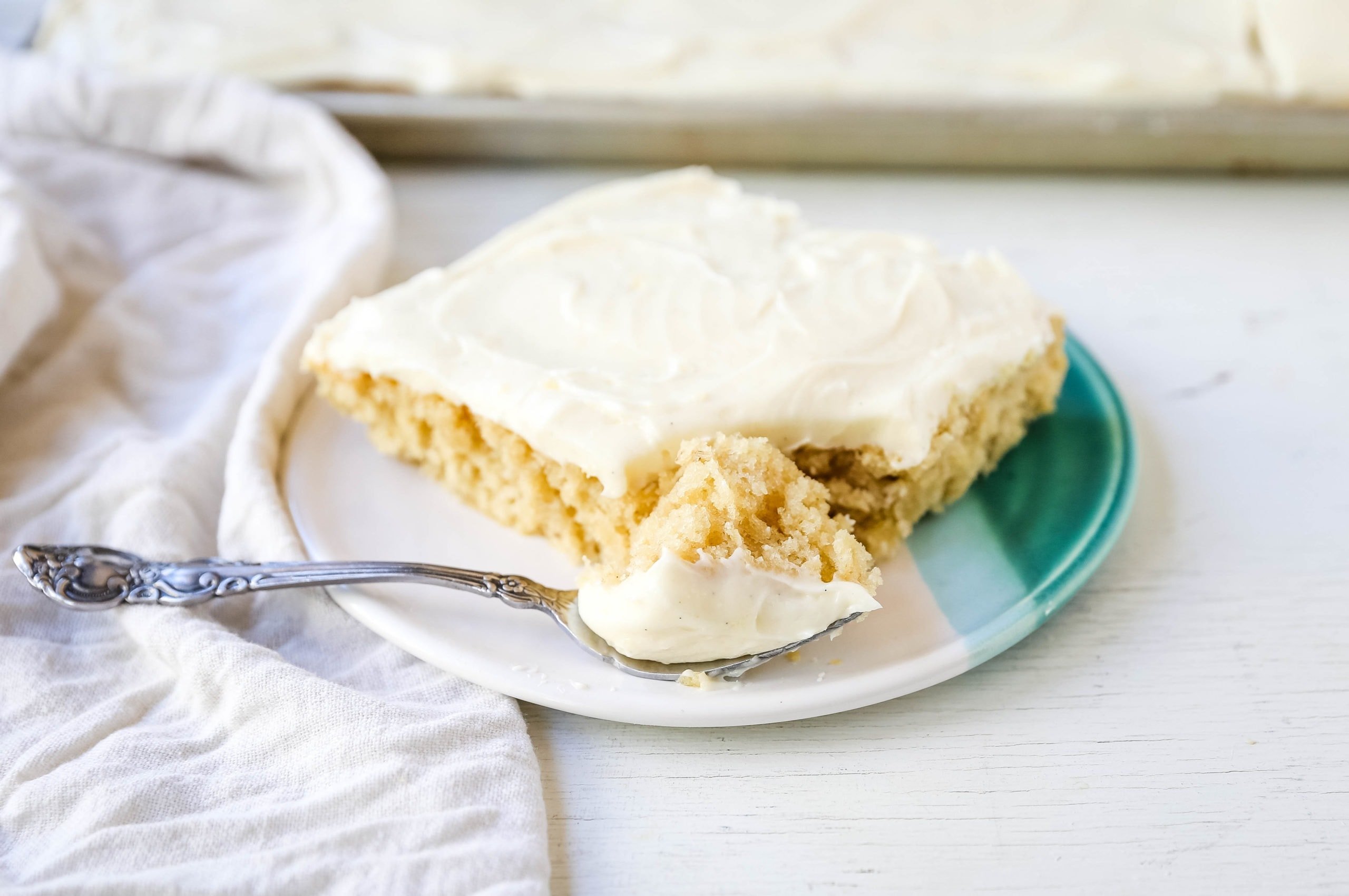 Banana Sheet Cake with Brown Butter Frosting Moist banana bars with a brown butter cream cheese buttercream. An easy frosted banana cake recipe! www.modernhoney.com #bananacake #bananabars #frostedbananacake #frostedbananabars #bananarecipes