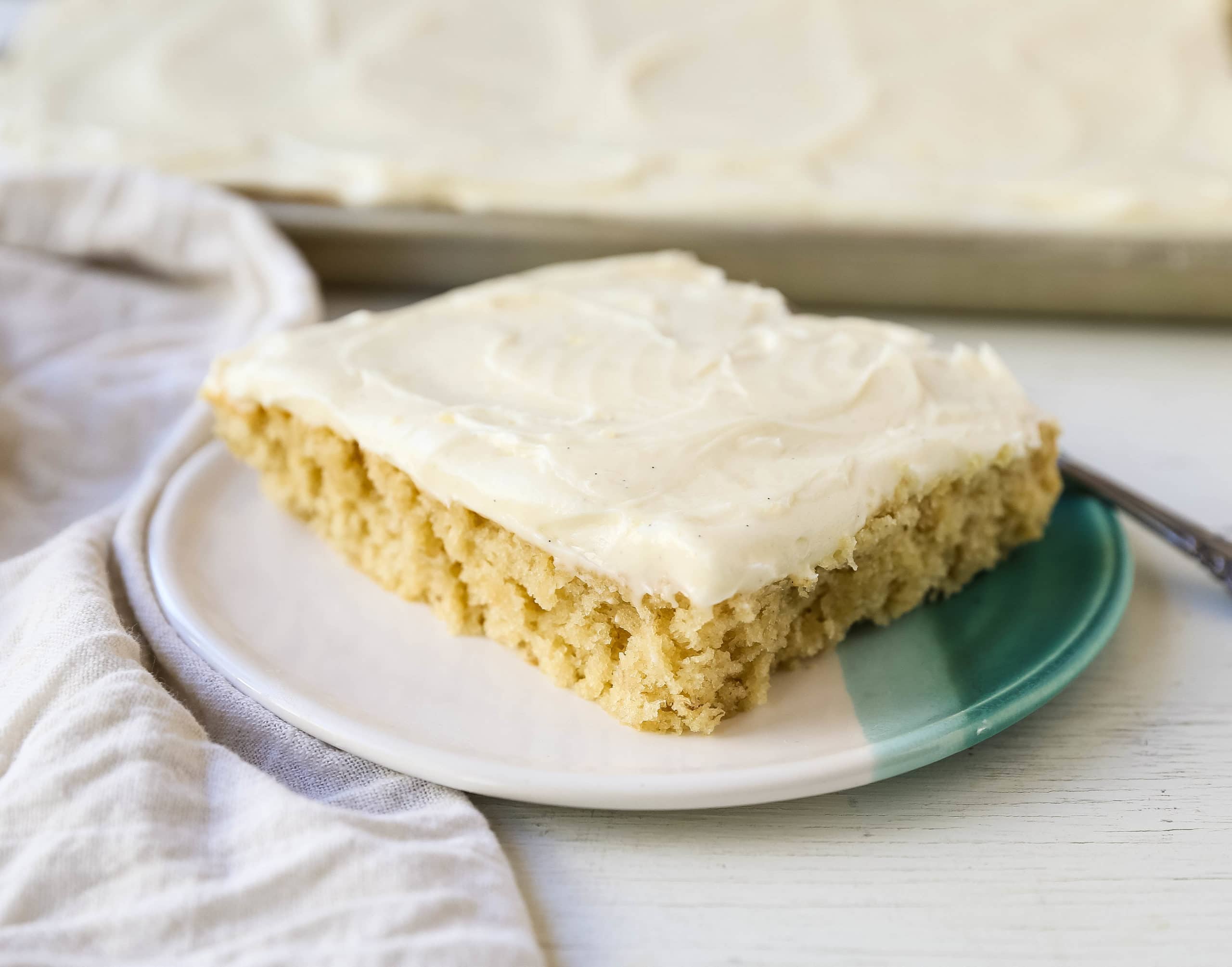 Banana Sheet Cake with Brown Butter Frosting Moist banana bars with a brown butter cream cheese buttercream. An easy frosted banana cake recipe! www.modernhoney.com #bananacake #bananabars #frostedbananacake #frostedbananabars #bananarecipes