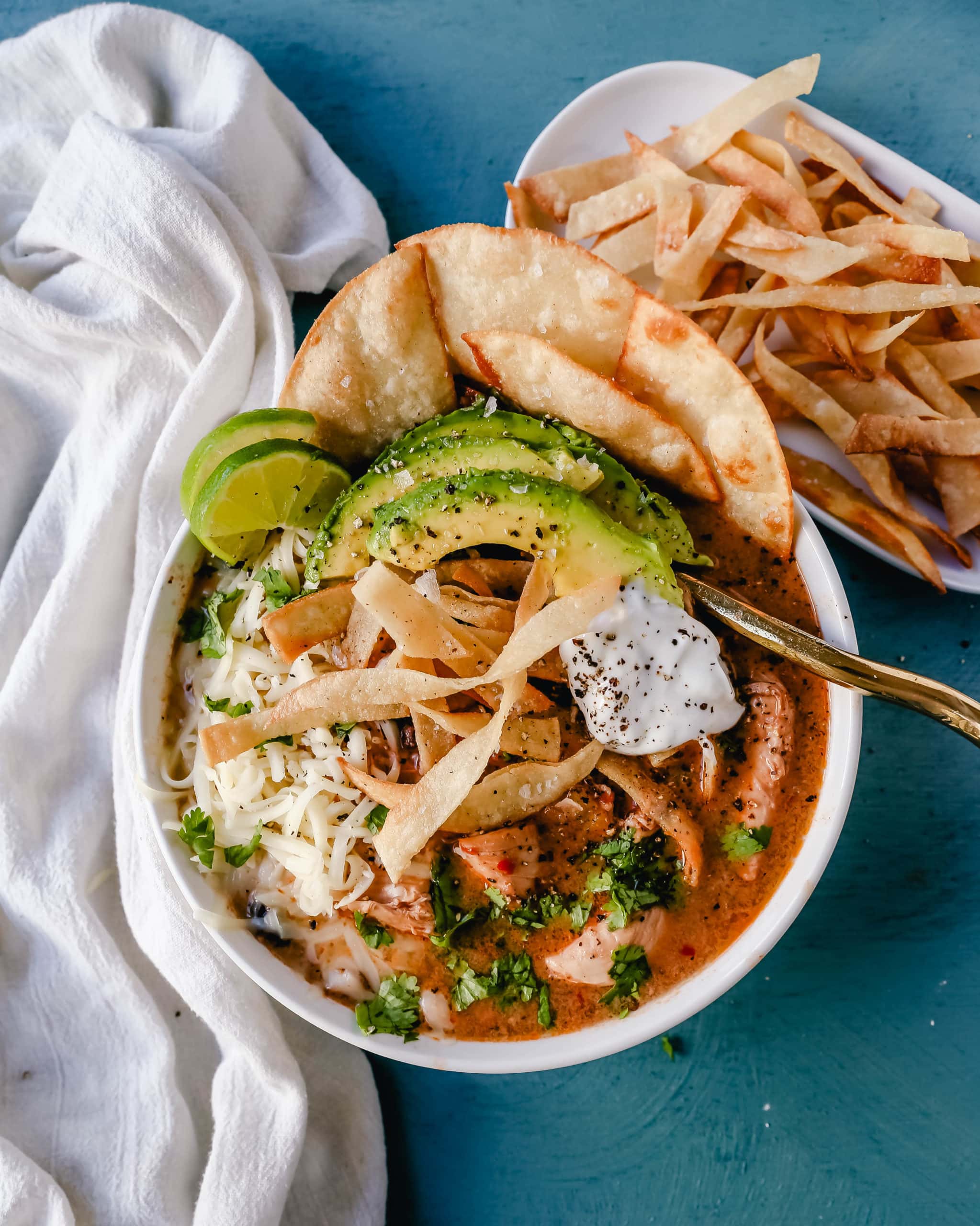 Slow Cooker Creamy Chicken Tortilla Soup Creamy, spicy, warm, and comforting creamy chicken tortilla soup all made in a crockpot! The best crockpot creamy chicken tortilla soup recipe! www.modernhoney.com #soup #chickentortillasoup #mexicanfood