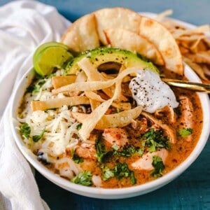 Slow Cooker Creamy Chicken Tortilla Soup Creamy, spicy, warm, and comforting creamy chicken tortilla soup all made in a crockpot! The best crockpot creamy chicken tortilla soup recipe! www.modernhoney.com #soup #chickentortillasoup #mexicanfood