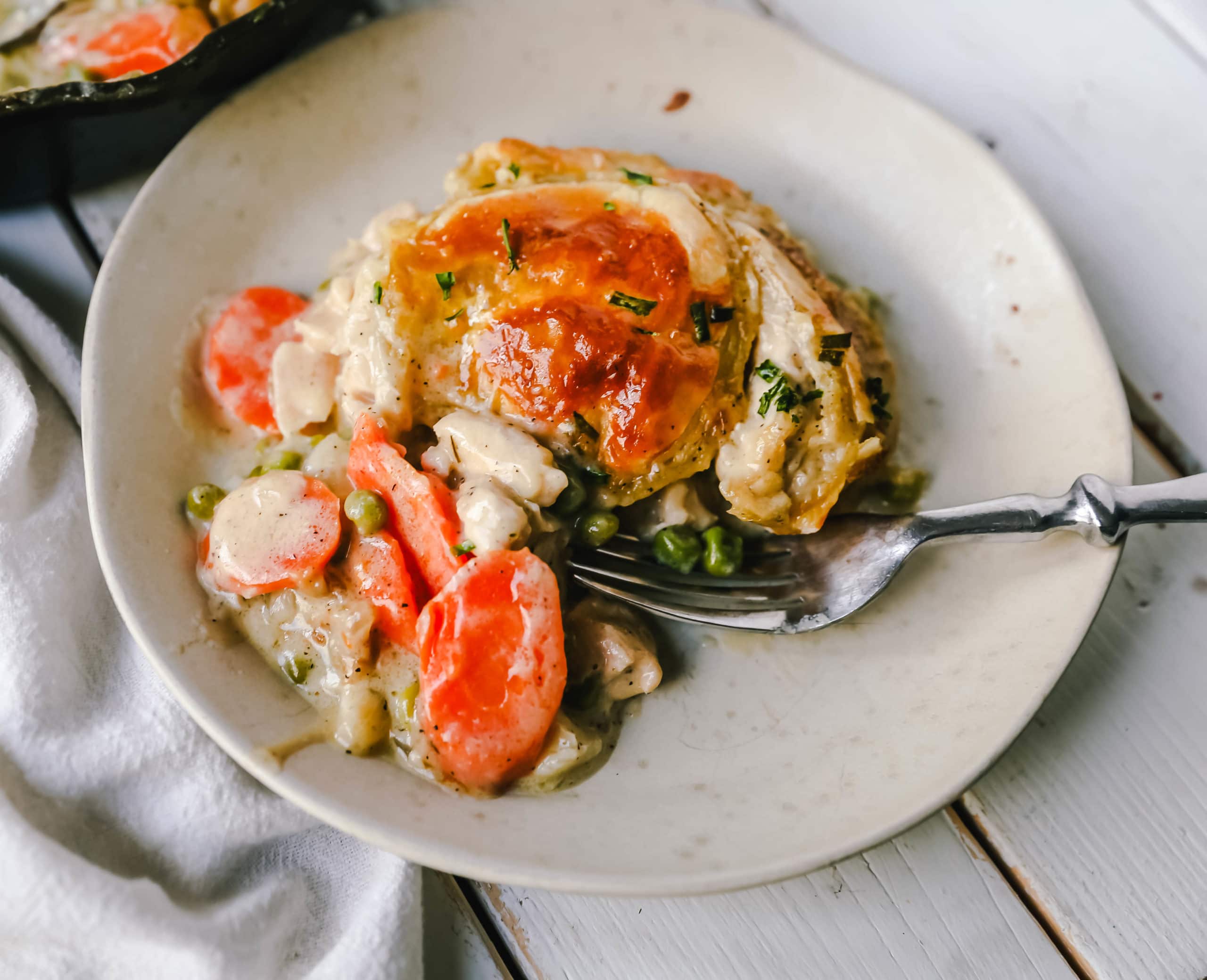 Skillet Chicken Pot Pie Easy, one-skillet chicken pot pie with vegetables baked in a cream sauce and topped with buttery puff pastry. A quick and easy chicken pot pie recipe! www.modernhoney.com #chickenpotpie #potpie #chicken 