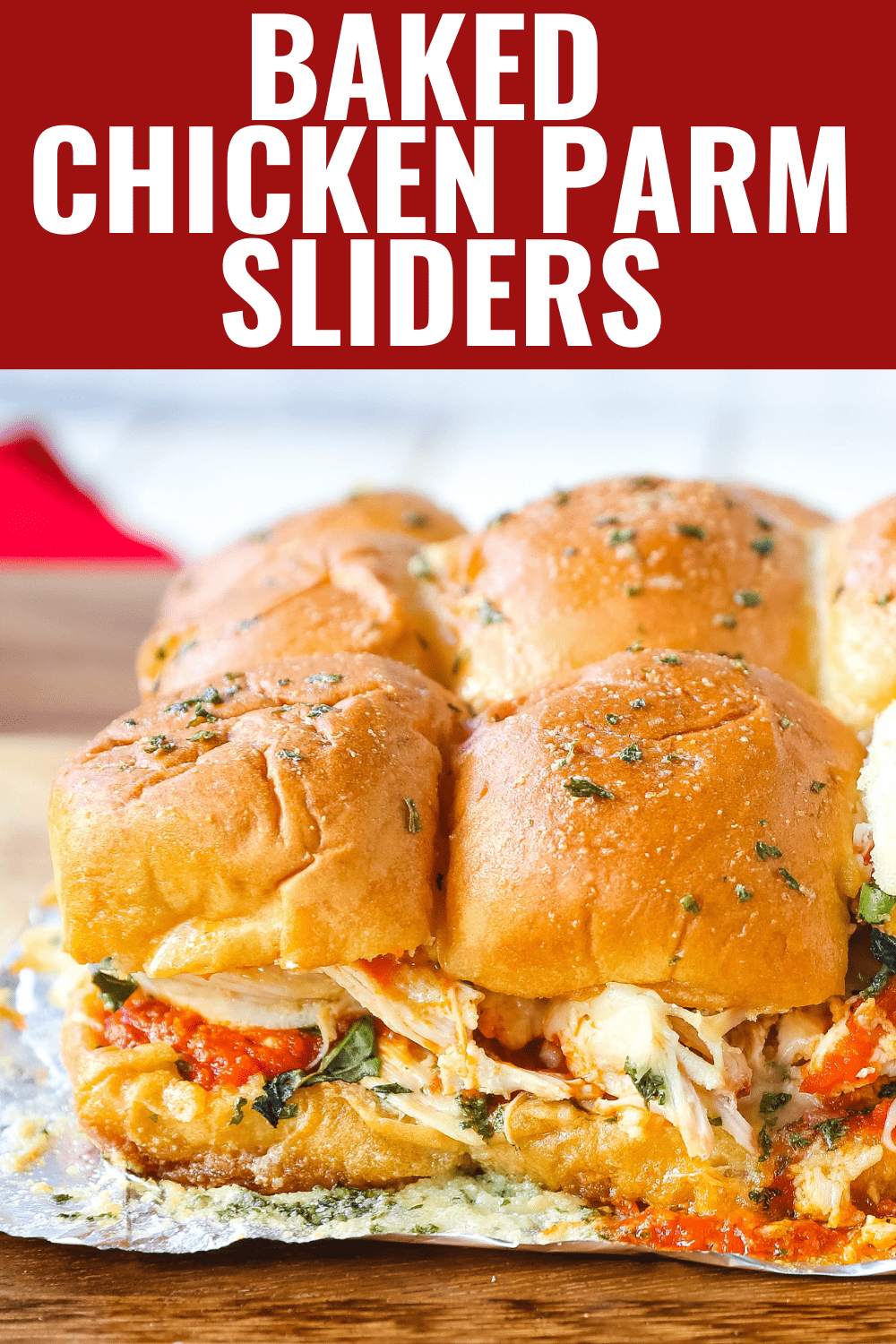 Baked Chicken Parm Sliders Chicken topped with a fresh marinara sauce topped with fresh mozzarella cheese and baked on Hawaiian sweet rolls and slathered with garlic butter. www.modernhoney.com #italian