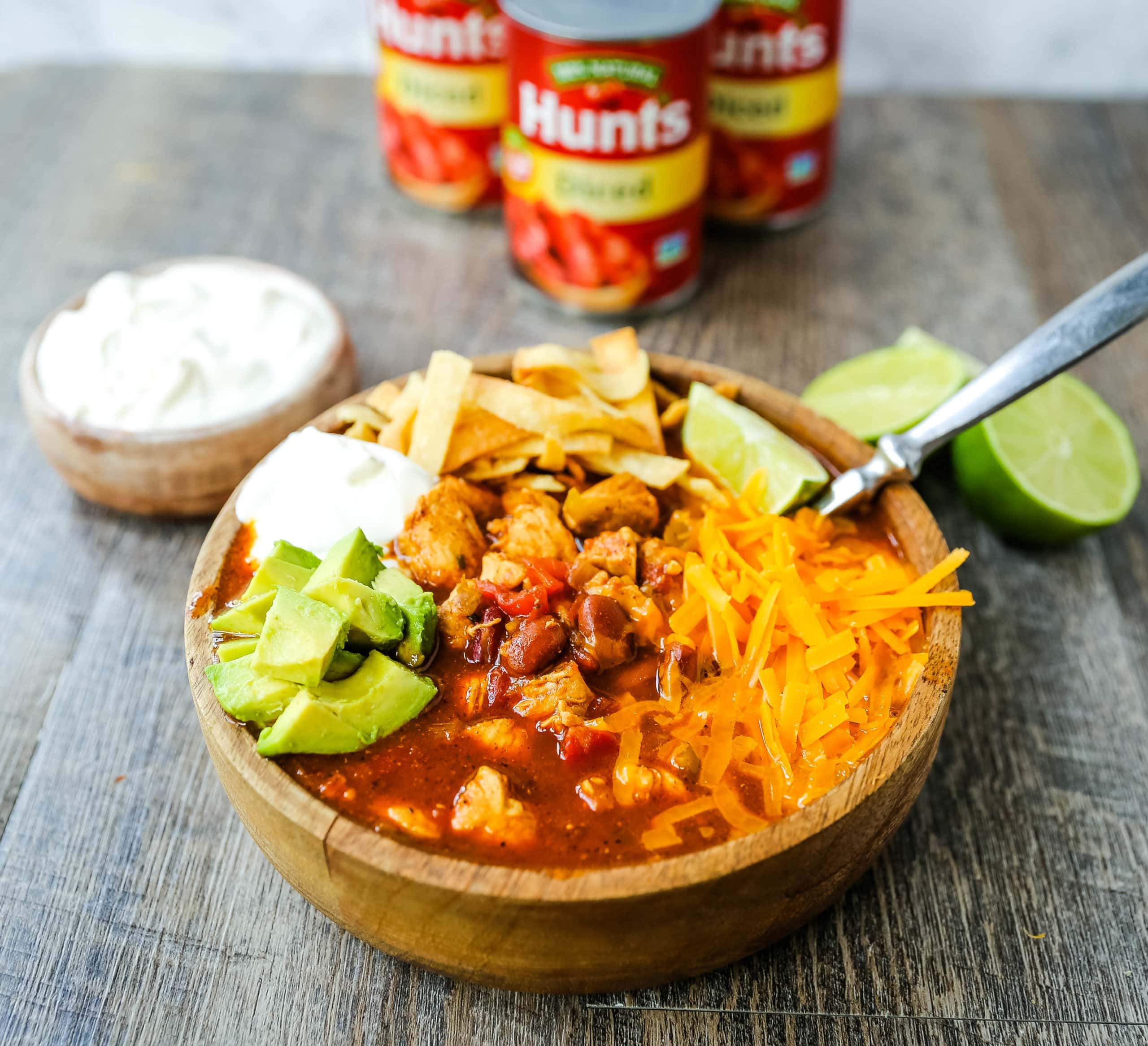 Chicken Chili. Traditional, homemade chicken chili with Mexican spices, green chilies, tomatoes, chili beans, and two secret ingredients to put it over the top! www.modernhoney.com #chili #chickenchili