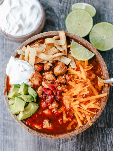 Chicken Chili. Traditional, homemade chicken chili with Mexican spices, green chilies, tomatoes, chili beans, and two secret ingredients to put it over the top! www.modernhoney.com #chili #chickenchili