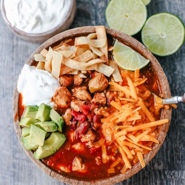 Chicken Chili. Traditional, homemade chicken chili with Mexican spices, green chilies, tomatoes, chili beans, and two secret ingredients to put it over the top! www.modernhoney.com #chili #chickenchili