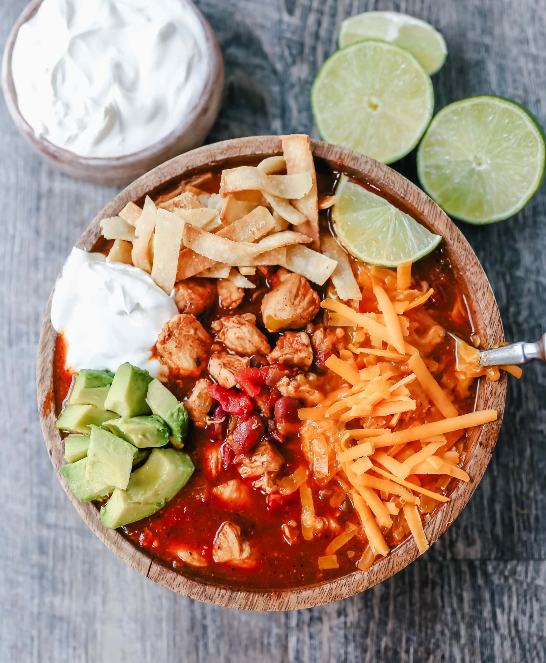 Chicken Chili. Traditional, homemade chicken chili with Mexican spices, green chilies, tomatoes, chili beans, and two secret ingredients to put it over the top! www.modernhoney.com #chili #chickenchili