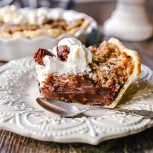 German Chocolate Pie. Creamy rich chocolate pie with a sticky German chocolate coconut-pecan topping and fresh whipped cream and chocolate shavings. www.modernhoney.com #pie #chocolatepie #germanchocolate