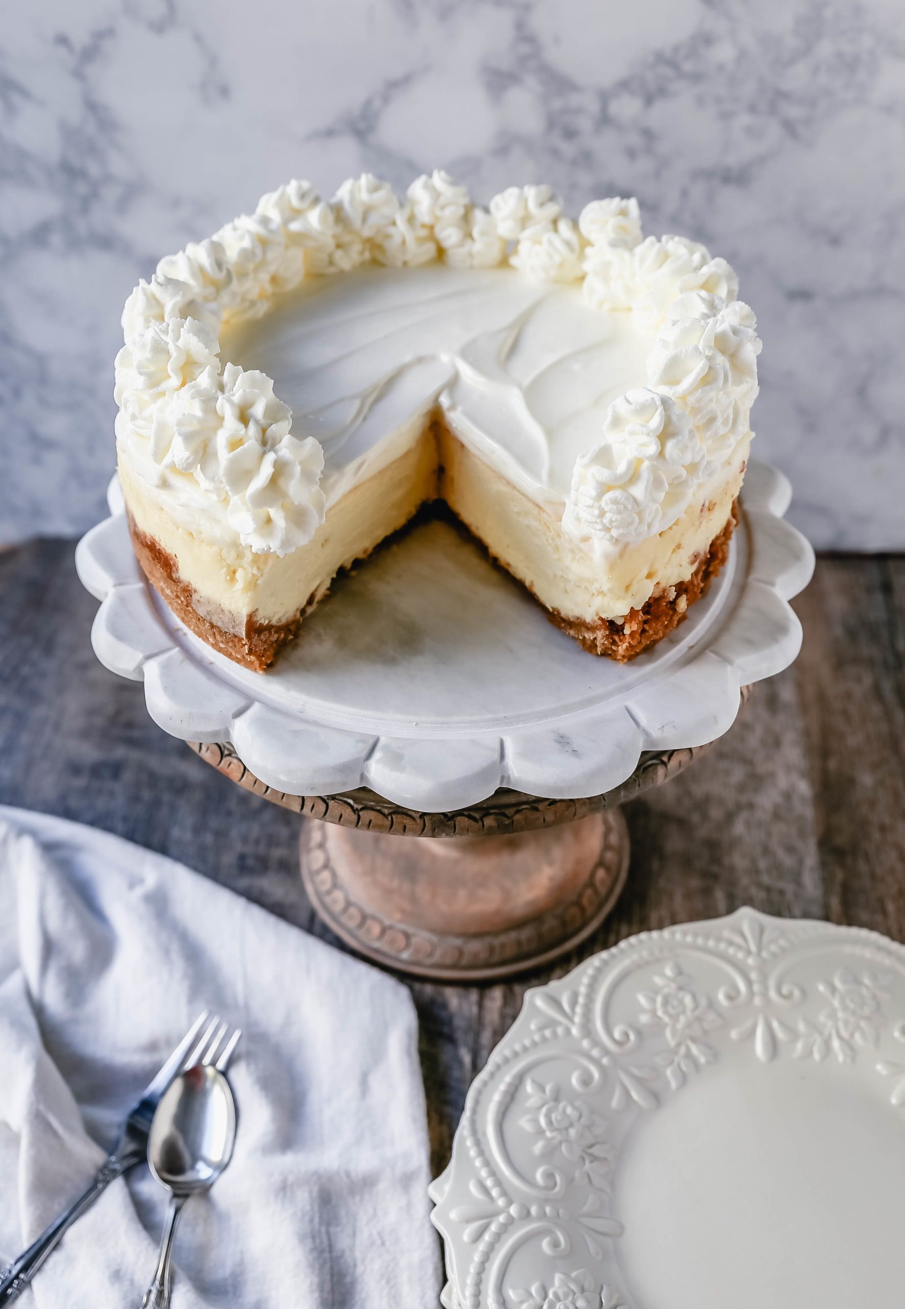 The Best Cheesecake Recipe How to make the creamiest, dreamiest, richest vanilla cheesecake with a buttery graham cracker crust. All of the tips and tricks for making the perfect cheesecake! www.modernhoney.com #cheesecake #vanillacheesecake #cheesecakerecipe #dessert