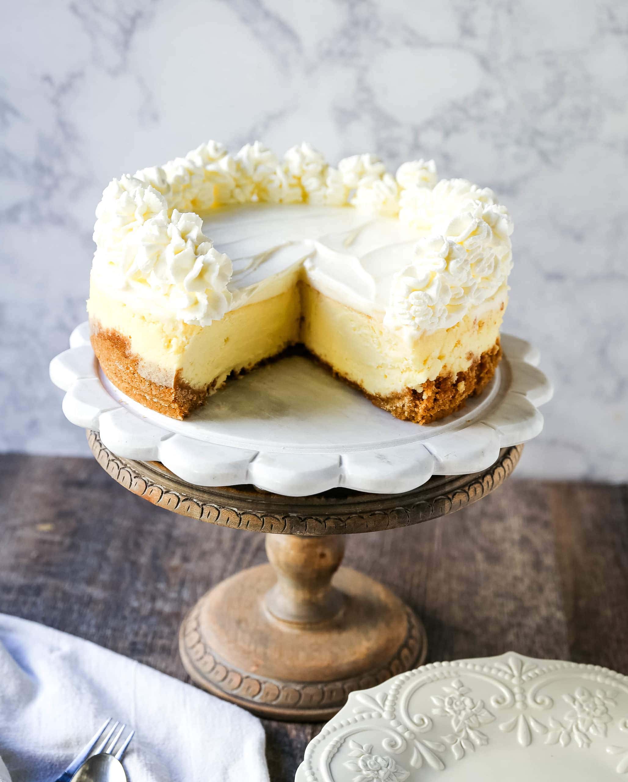 The Best Cheesecake Recipe How to make the creamiest, dreamiest, richest vanilla cheesecake with a buttery graham cracker crust. All of the tips and tricks for making the perfect cheesecake! www.modernhoney.com #cheesecake #vanillacheesecake #cheesecakerecipe #dessert