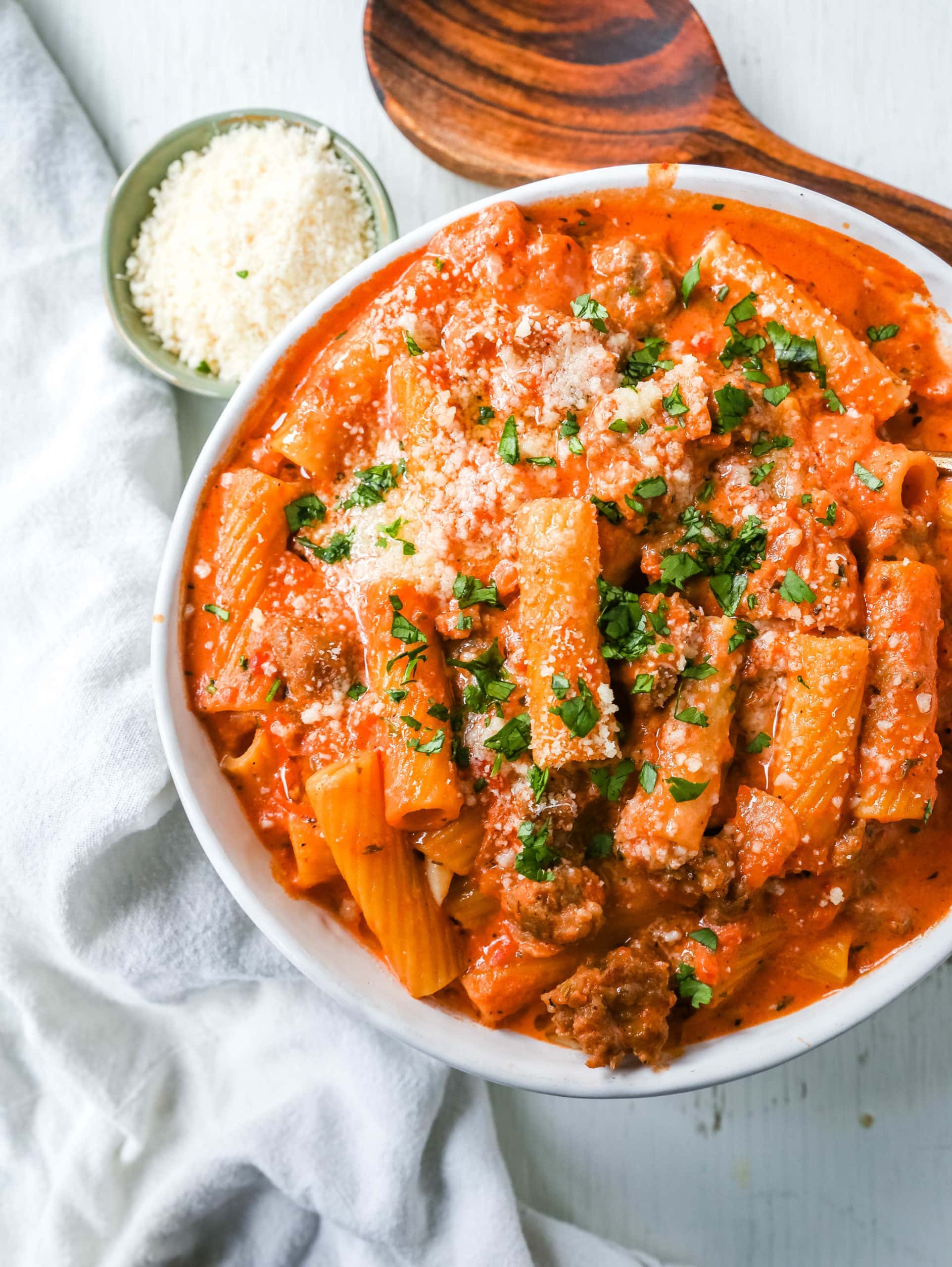 "Date Me" Creamy Sausage Rigatoni Pasta Homemade rich and creamy tomato cream and sausage sauce tossed with rigatoni and topped with parmesan cheese. The best creamy sausage rigatoni pasta! #pasta #dinner