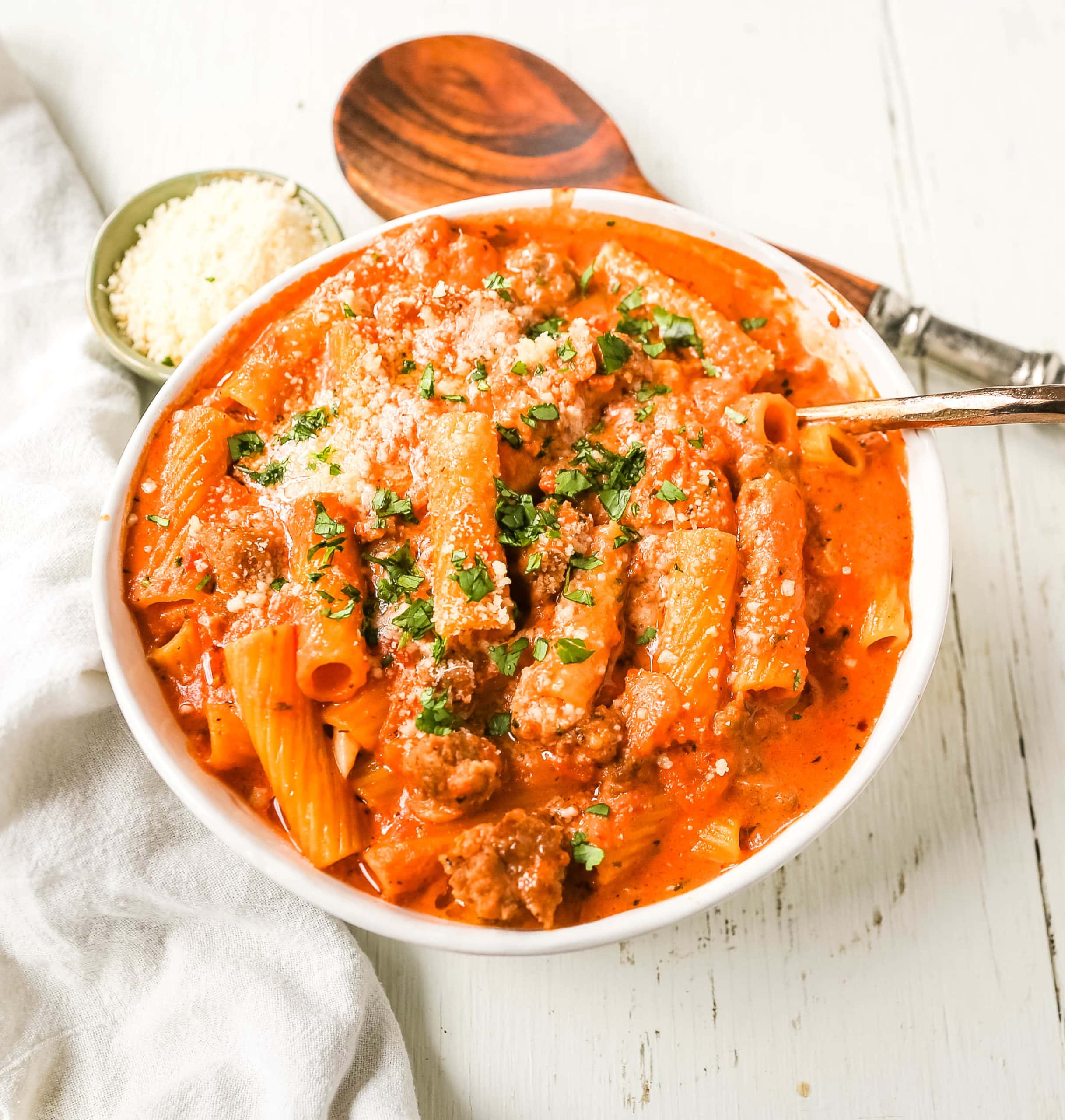 "Date Me" Creamy Sausage Rigatoni Pasta Homemade rich and creamy tomato cream and sausage sauce tossed with rigatoni and topped with parmesan cheese. The best creamy sausage rigatoni pasta! #pasta #dinner