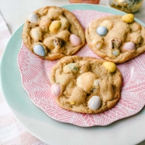 Chocolate Cadbury Egg Cookies A White Chocolate Chip and Famous Chocolate Mini Cadbury Eggs Cookie. Soft and chewy centers with crispy edges and decadent mini Cadbury eggs. A perfect Easter cookie! www.modernhoney.com #cookie #cookies #eastercookie #cadburyeggs